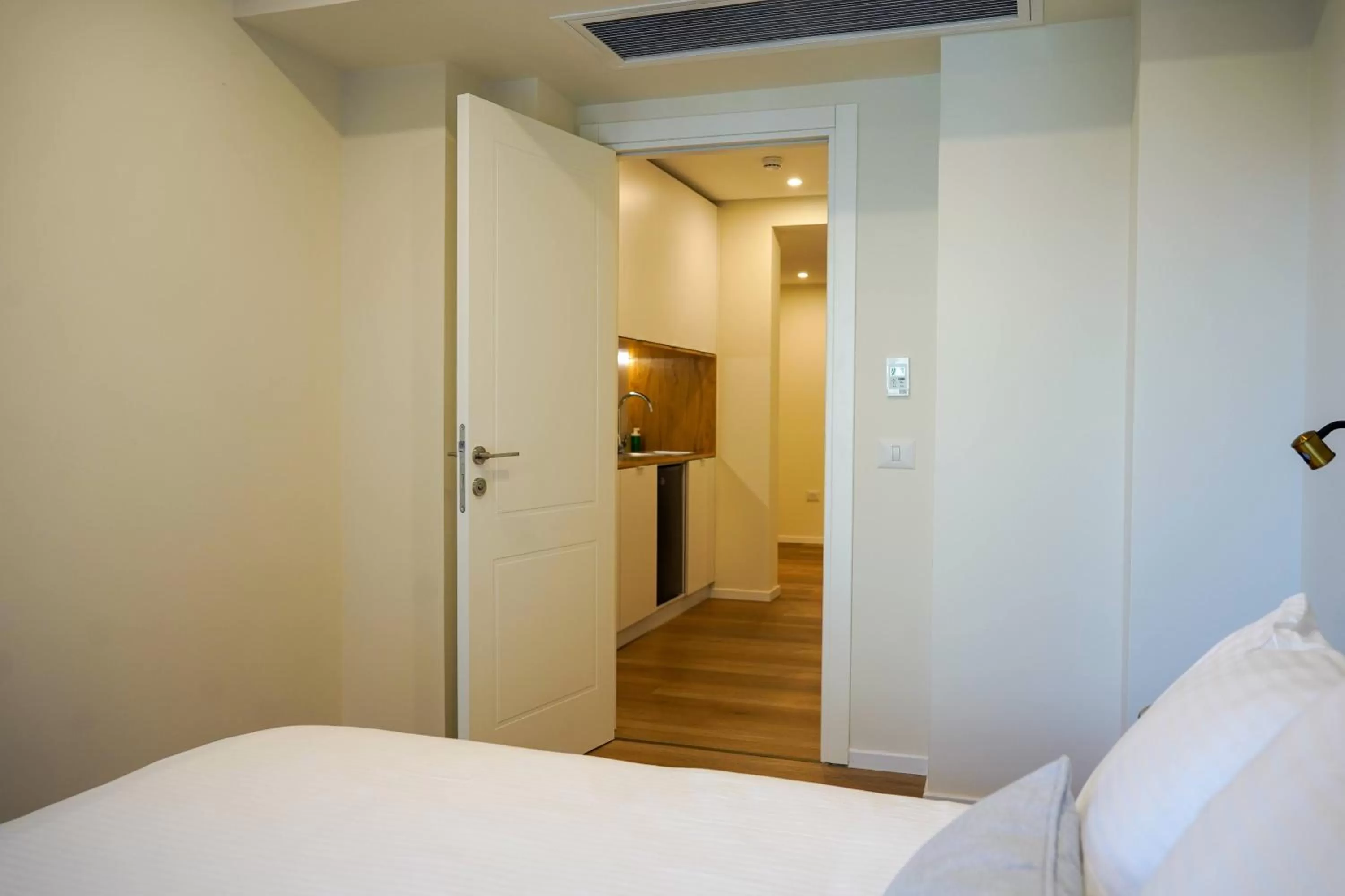 Bedroom, Bed in Urbanic Apartments