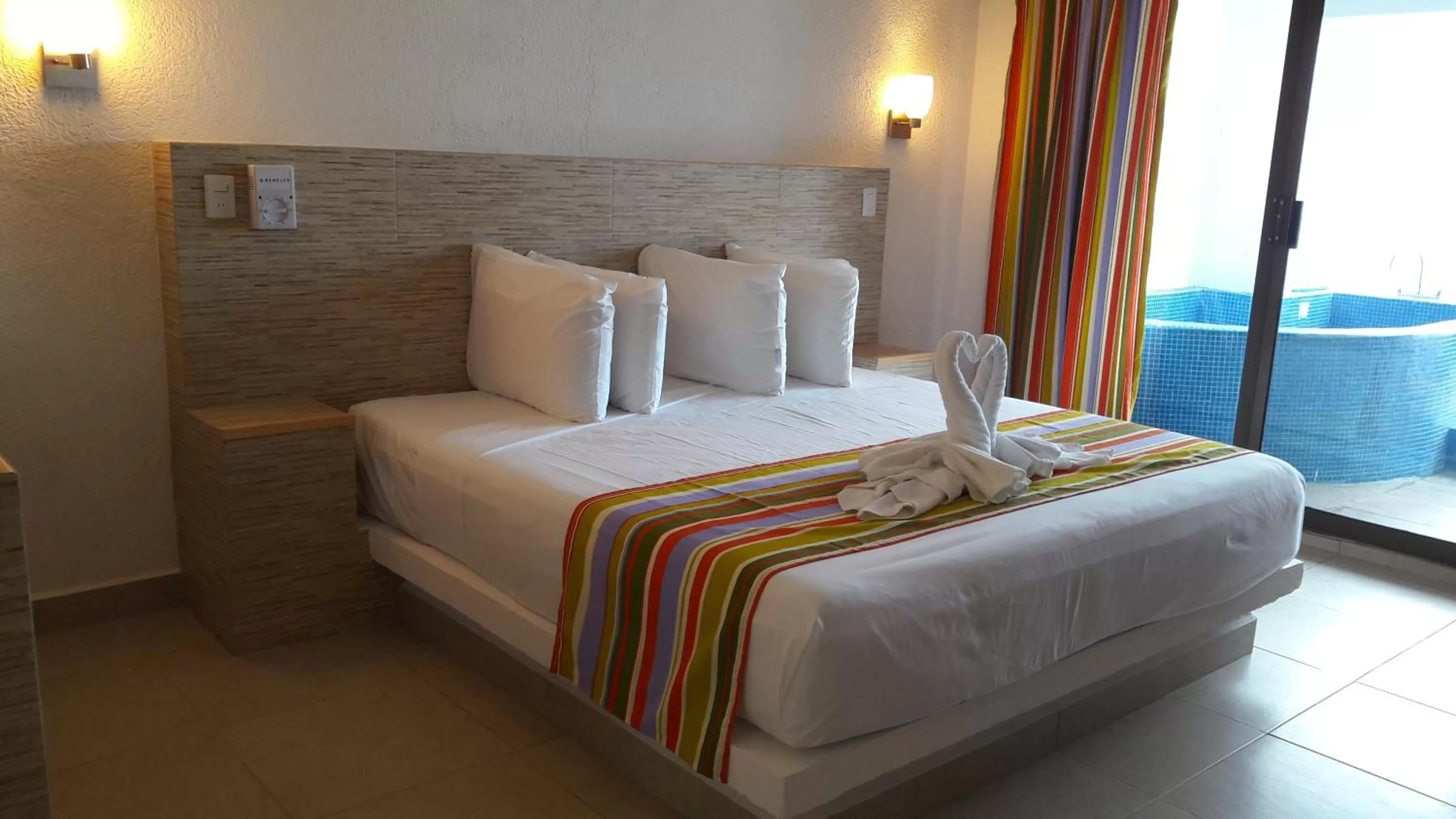 Bed in Pelicano Inn Playa del Carmen - Beachfront Hotel