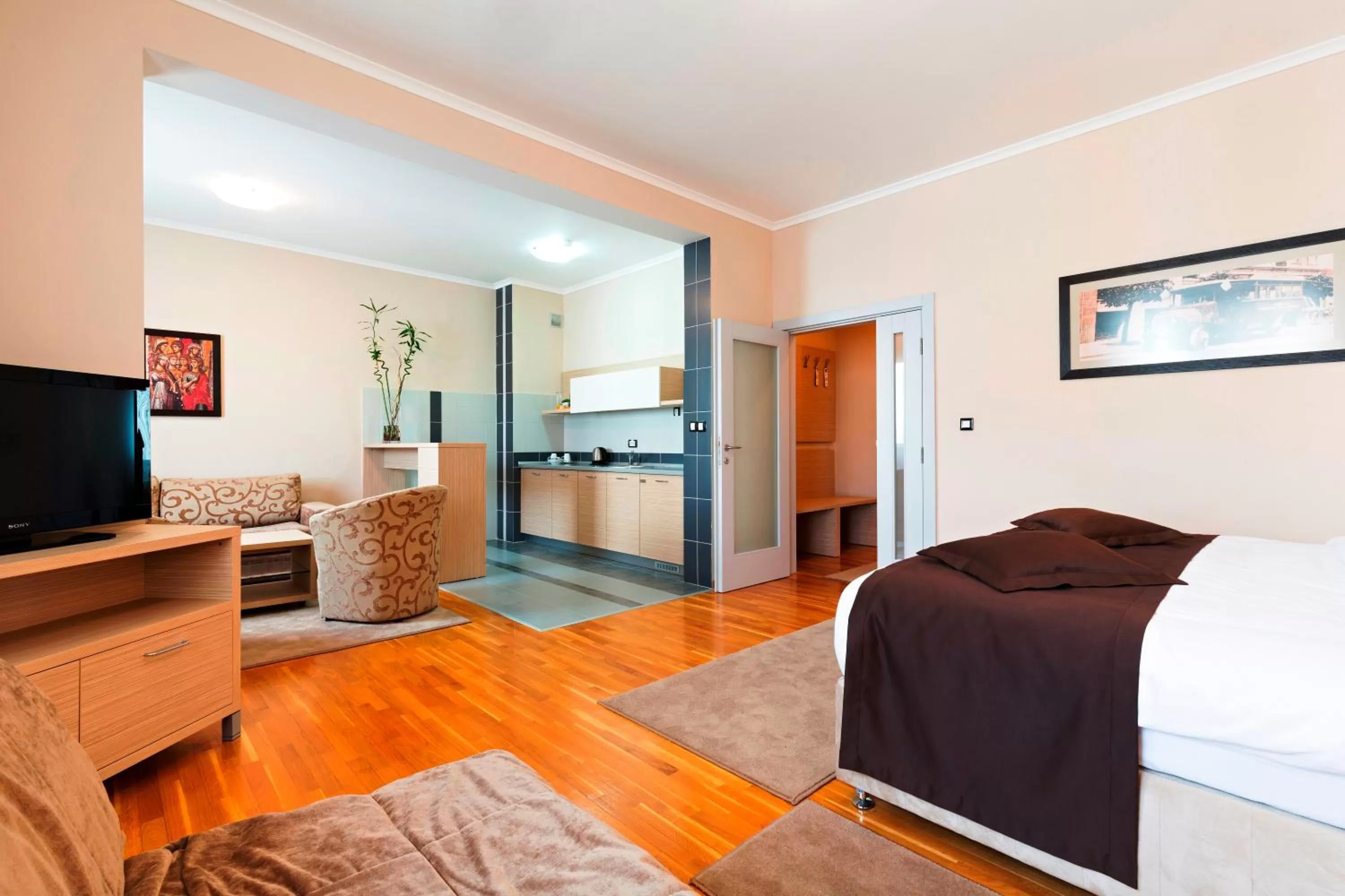 Kitchen or kitchenette, Bed in Garni Hotel Nevski