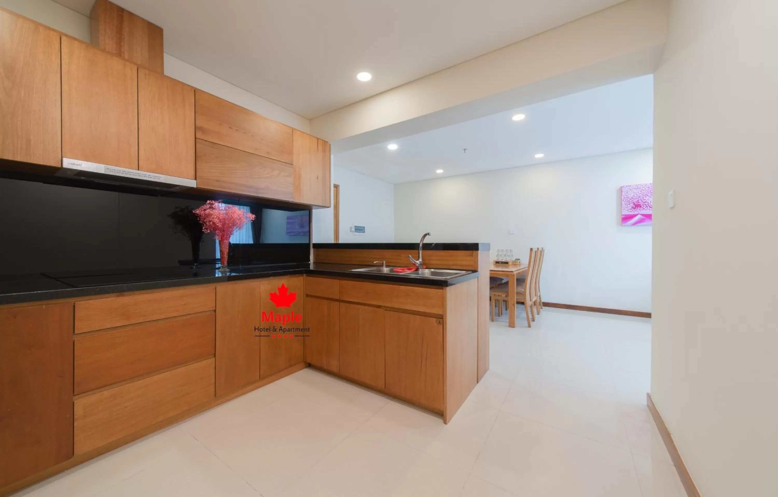 Kitchen or kitchenette in Maple Hotel & Apartment
