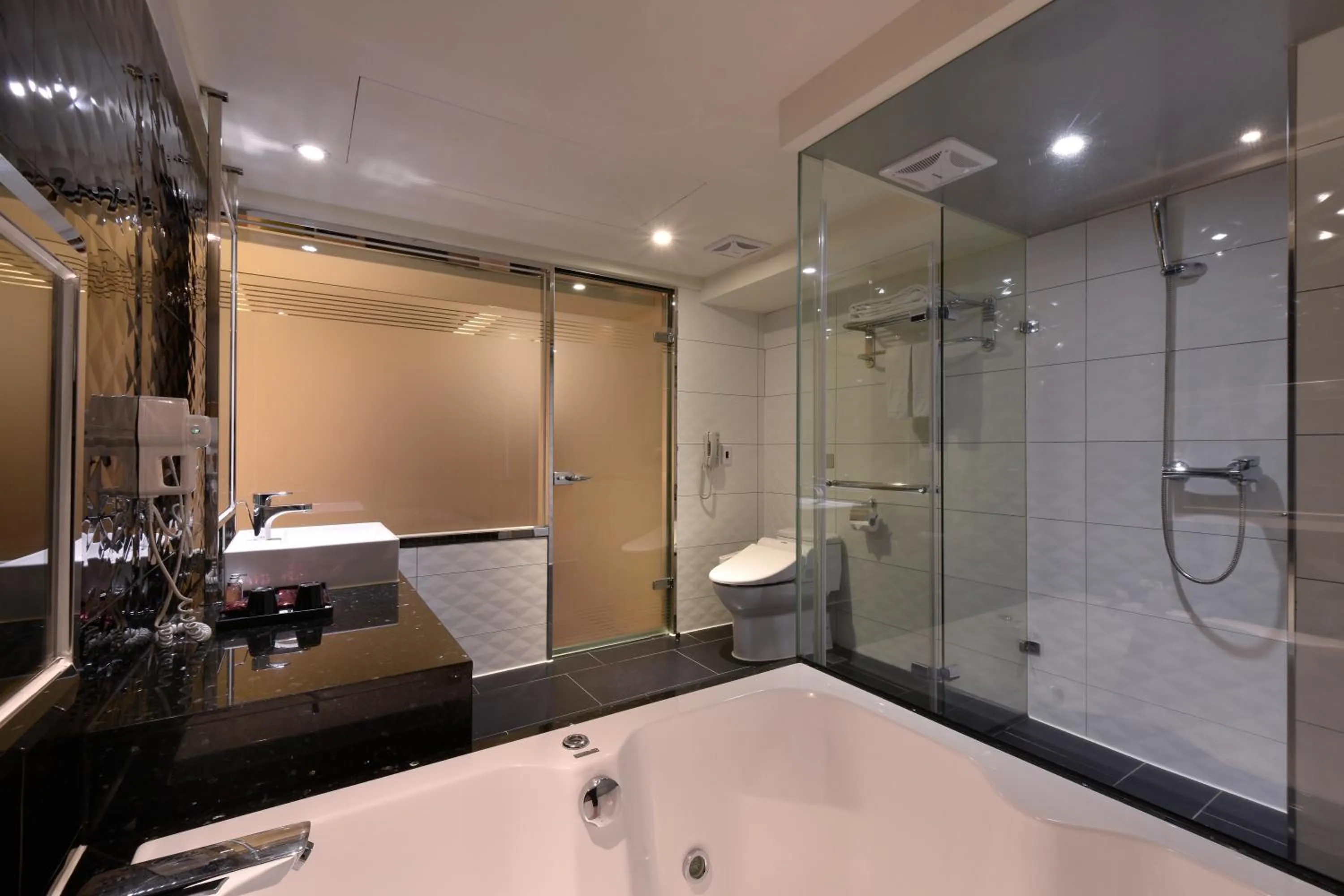 Bathroom in V-one Vogue Hotel