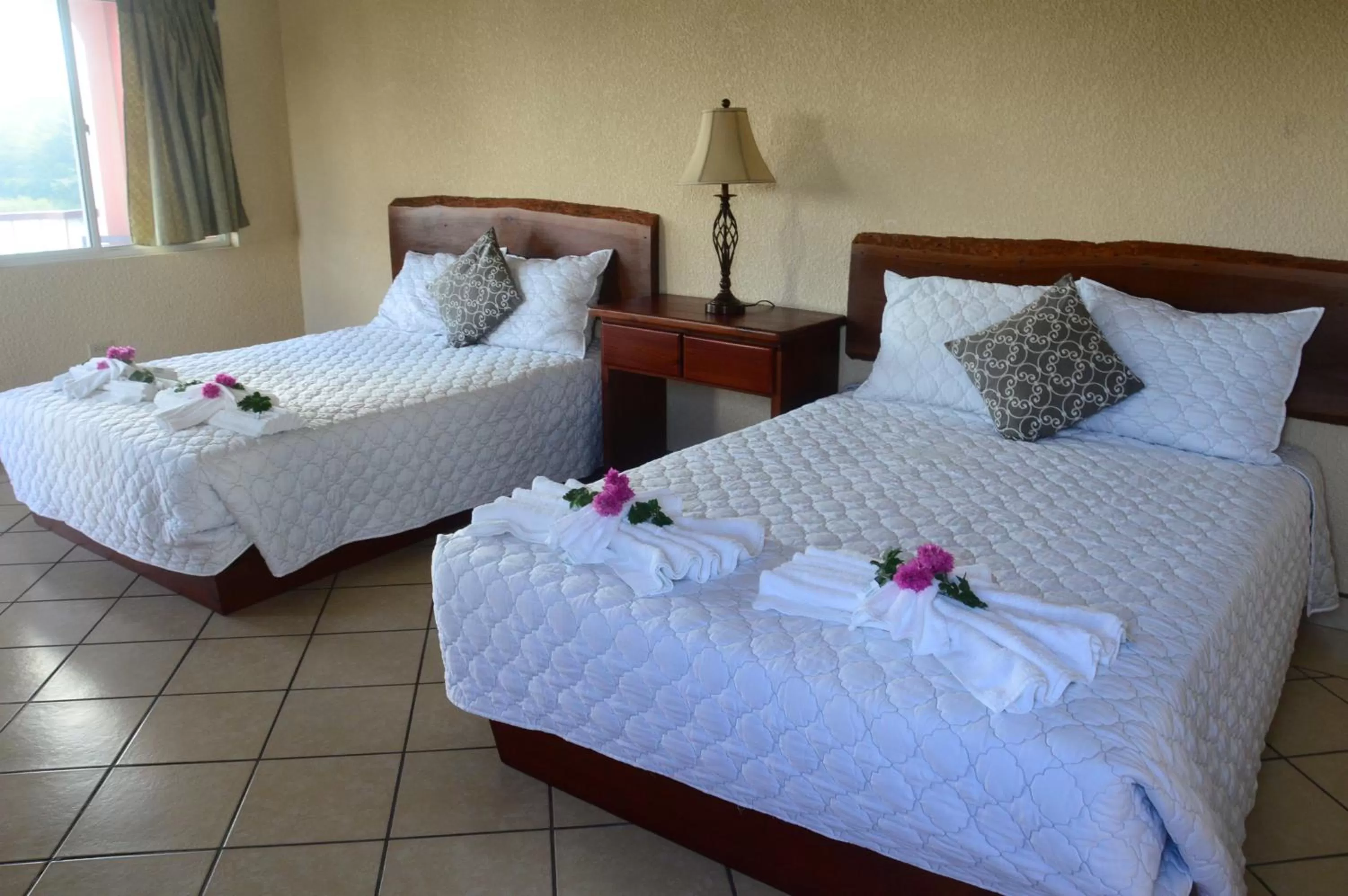 Bed in Lamanai Hotel & Marina