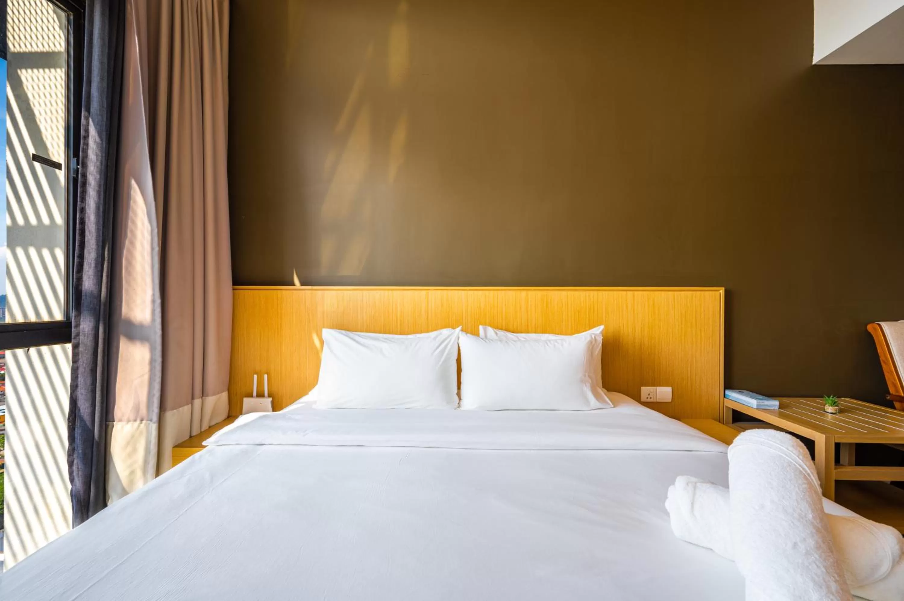 Bed in Greystone 99 Suites