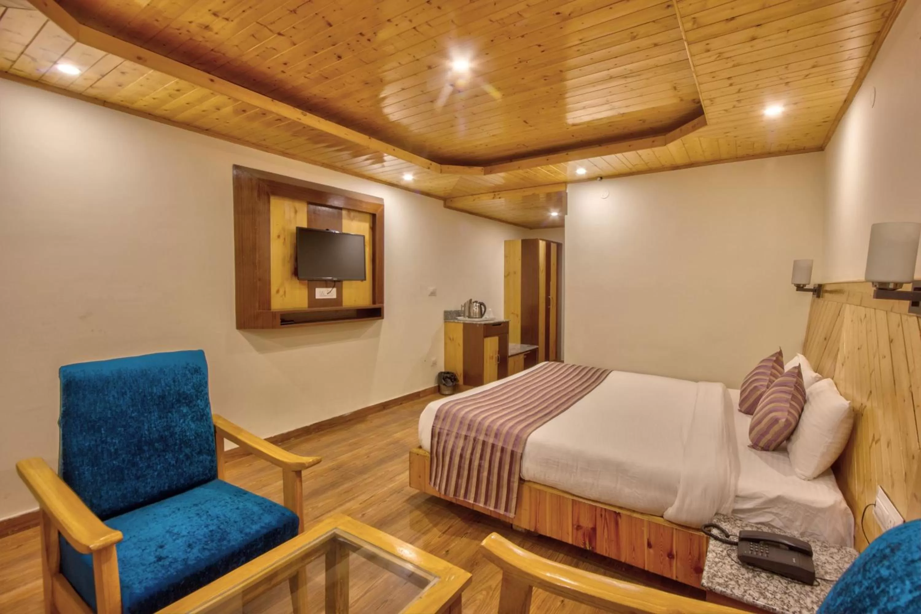 Bed in Snow City's Montana Blues Resort Manali - Heated & Air-Cooled Stay