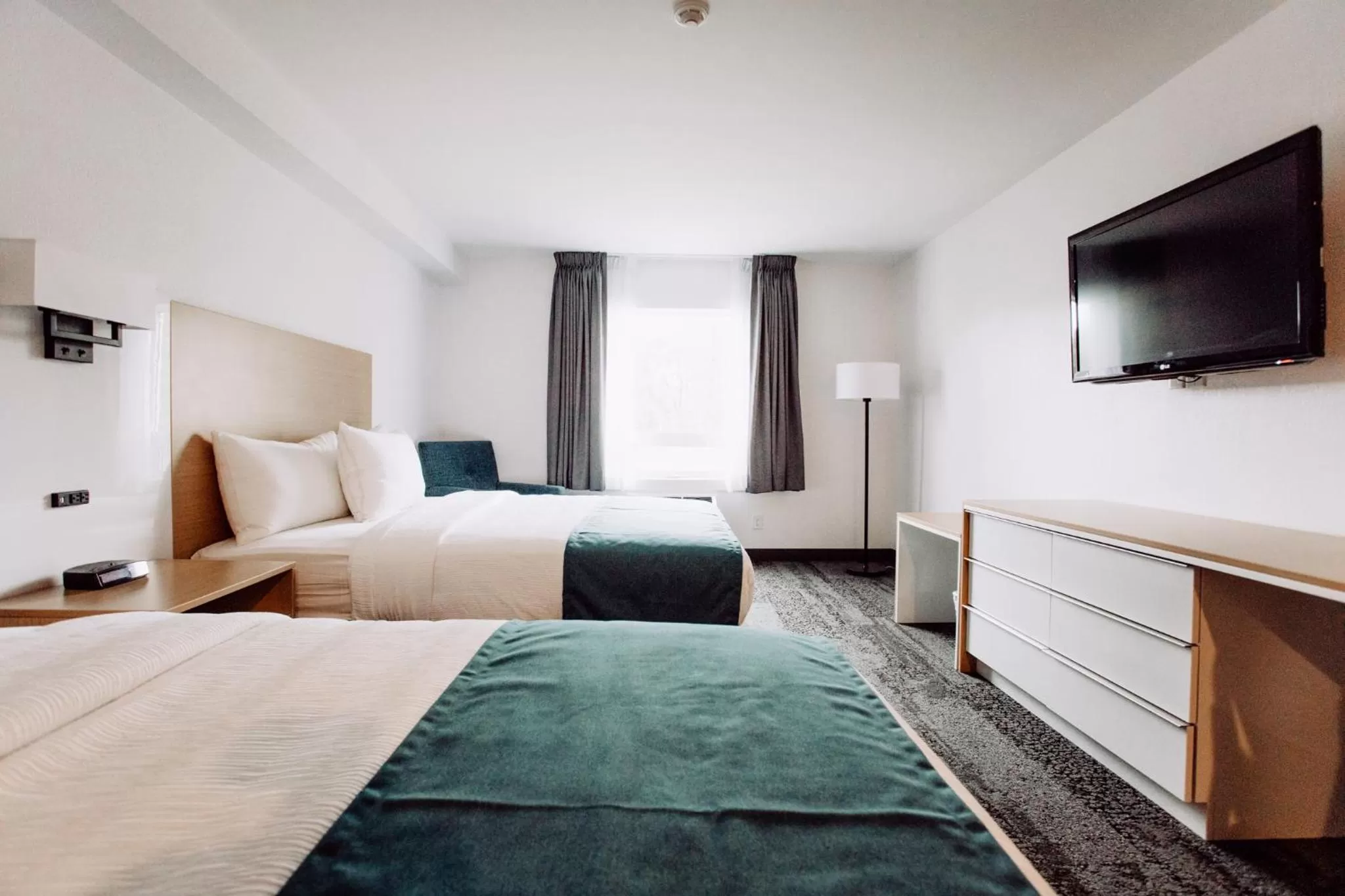 Bed in La Place Rendez-Vous Hotel