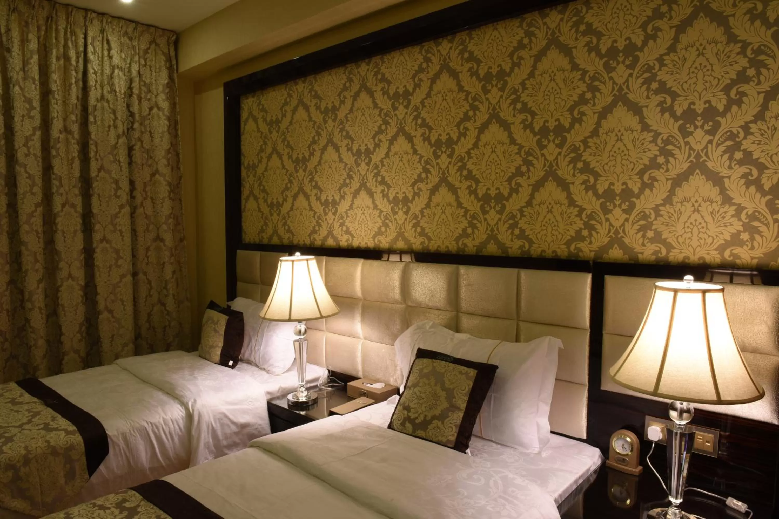 Bed in Garden Plaza Hotel