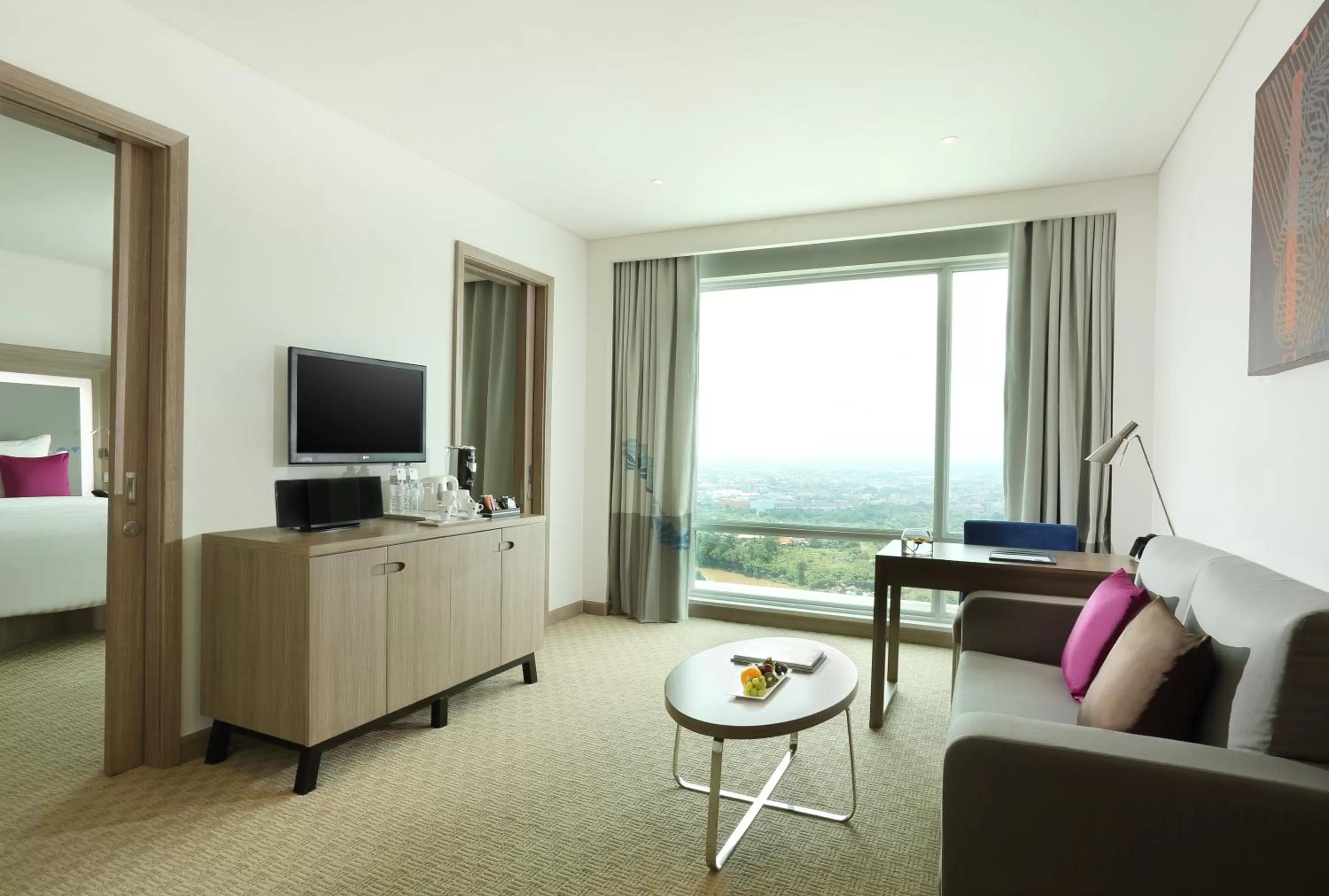 Living room, Bed in Novotel Tangerang