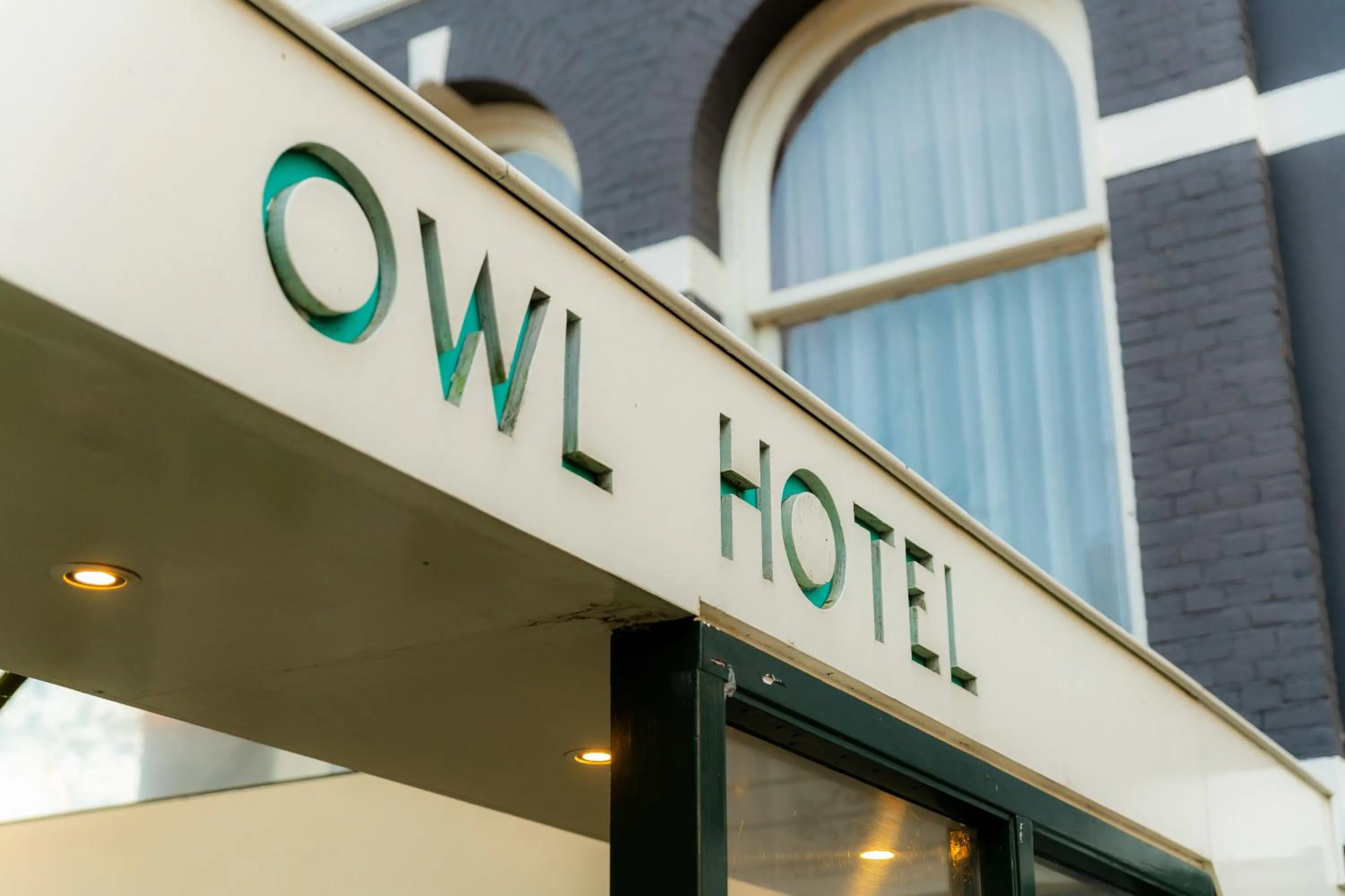 Property logo or sign in Owl Hotel