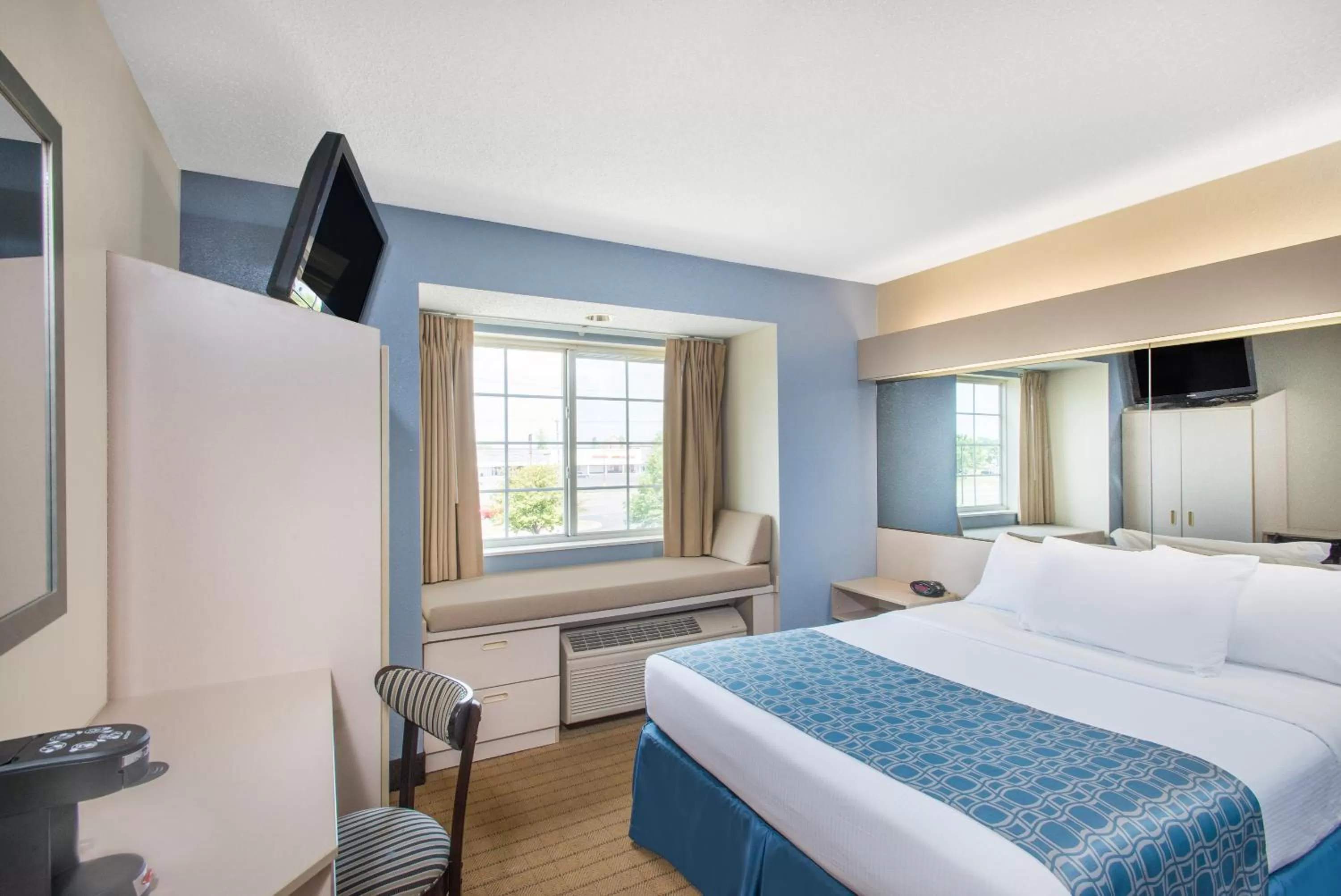 Bed in Microtel Inn & Suites by Wyndham
