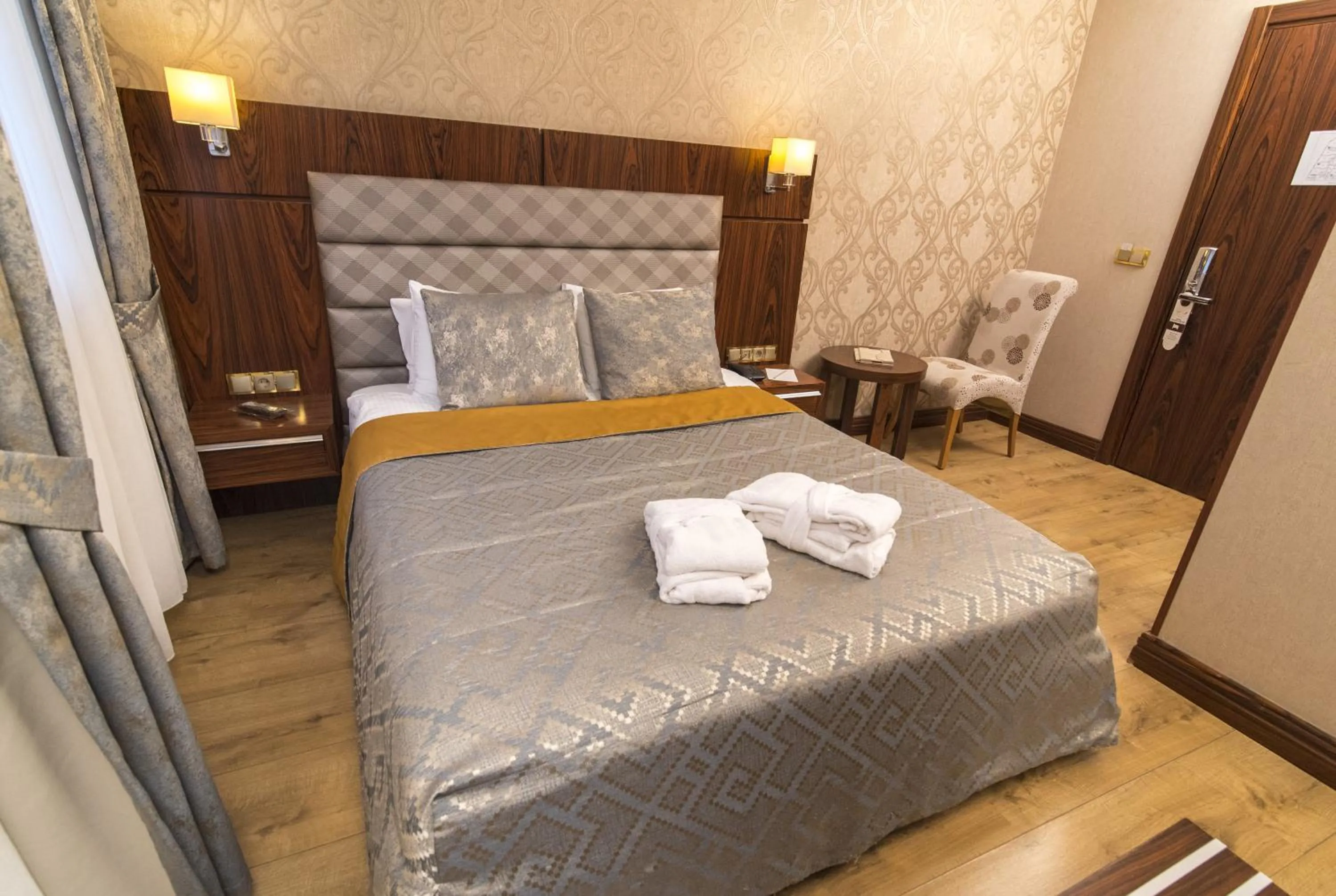 Bed in MidMar Deluxe Hotel