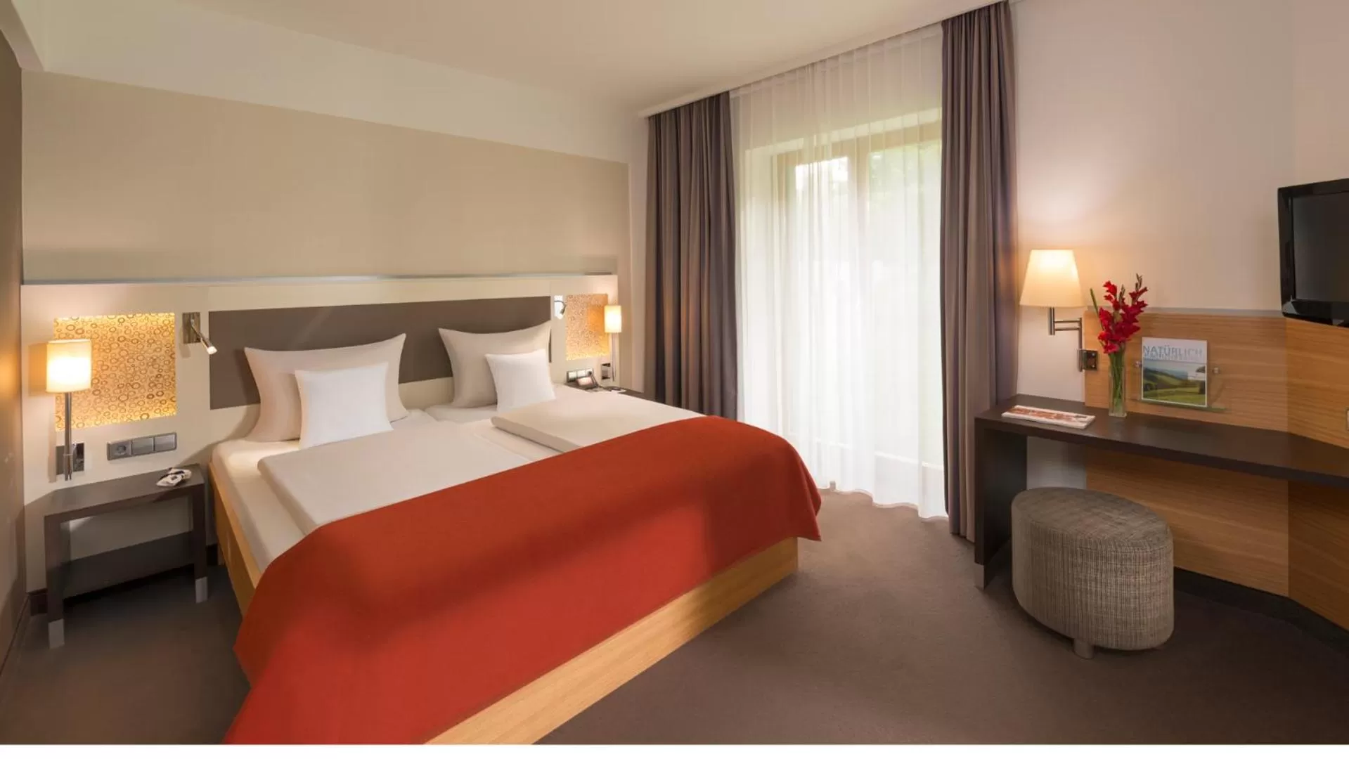 Photo of the whole room, Bed in Dorint Thermenhotel Freiburg