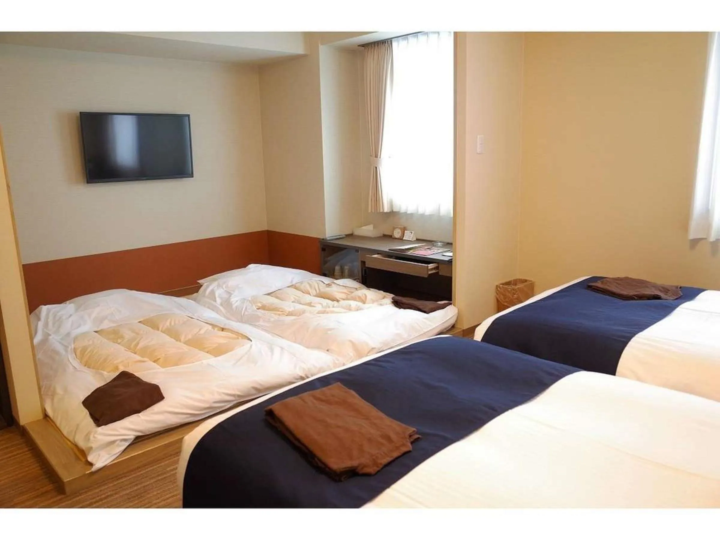 Bed in Hotel WBF Grande Asahikawa