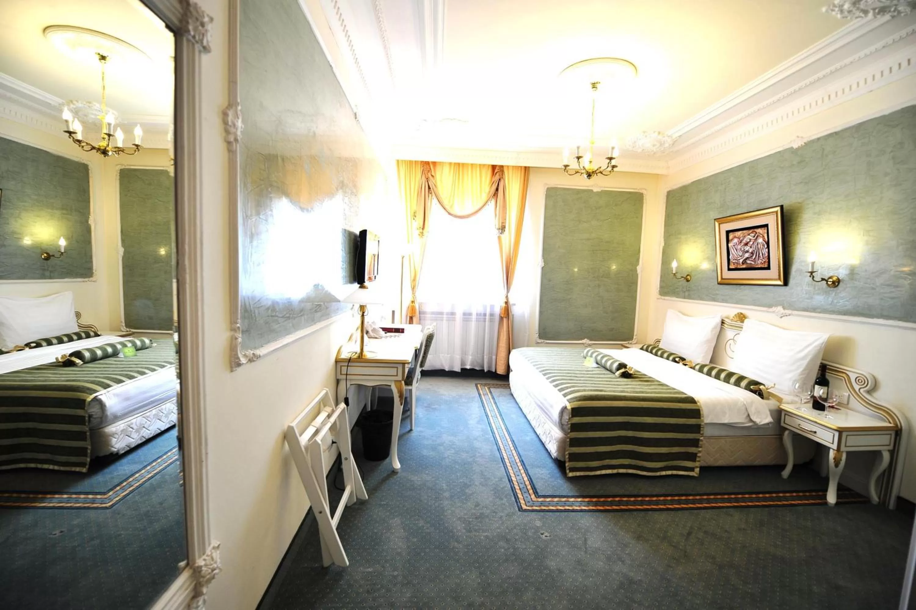 Bed in Queen's Astoria Design Hotel