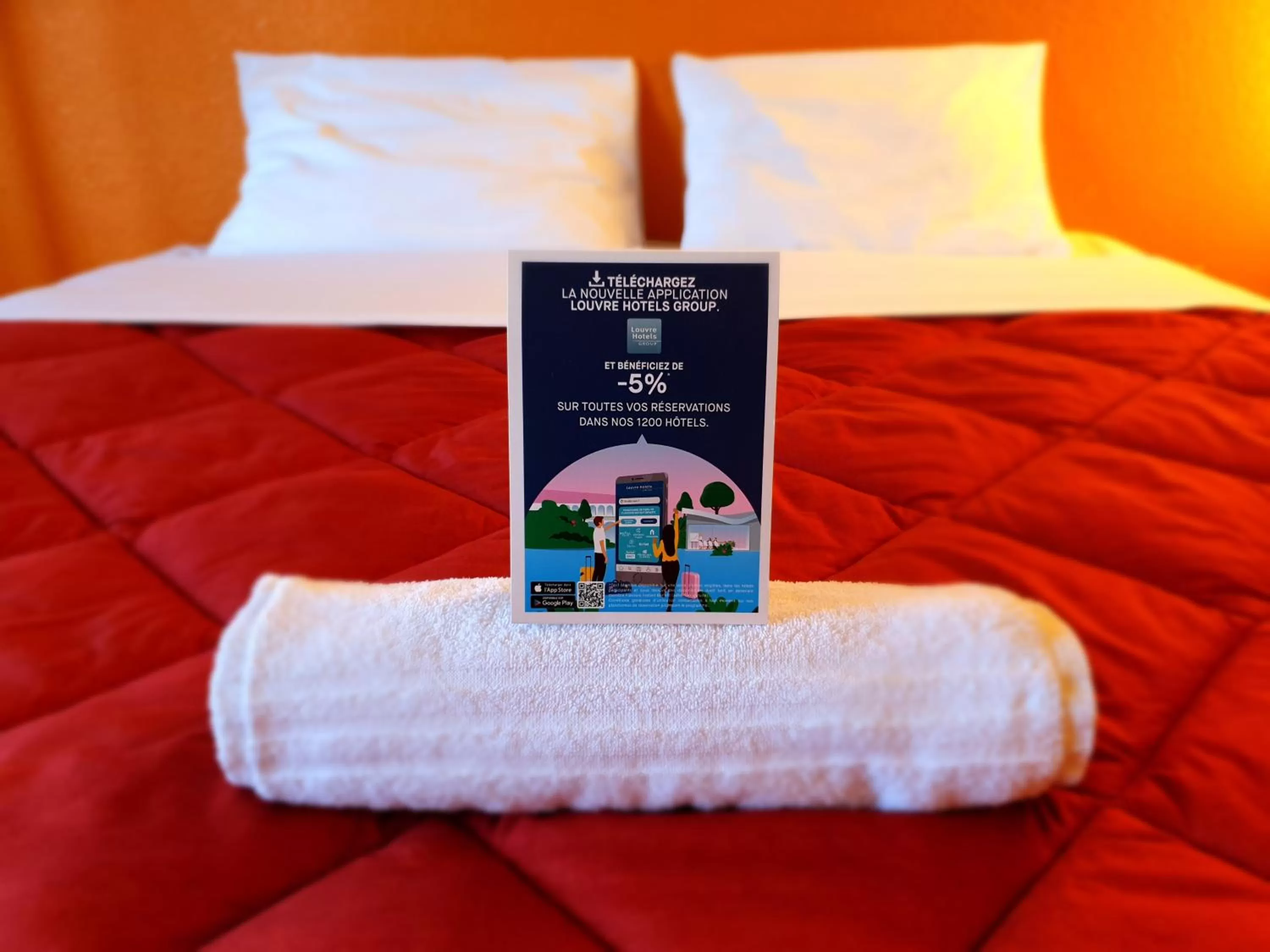 towels, Bed in Premiere Classe Nancy Est Essey