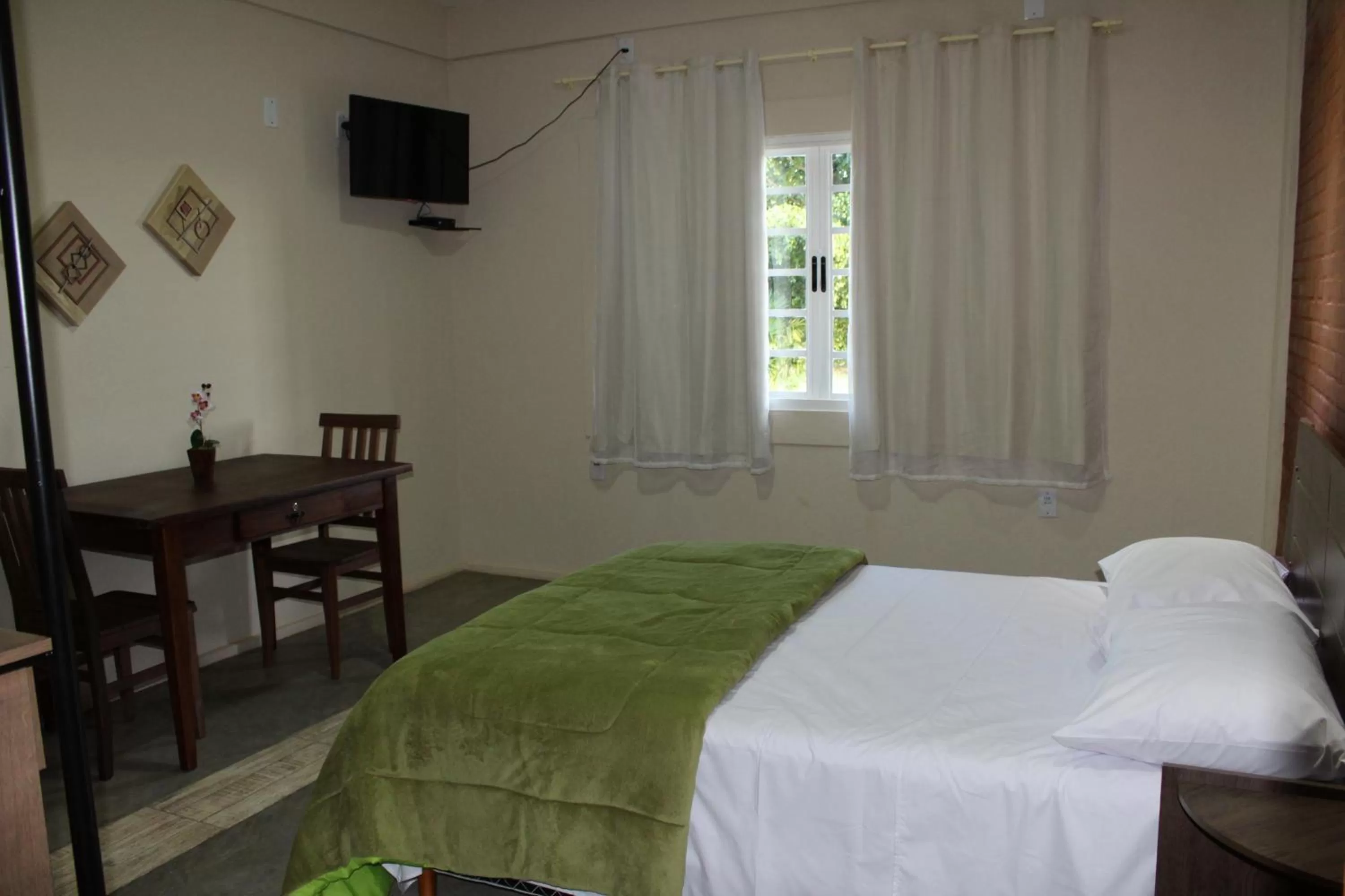 Bed in Pousada Morro dos Ventos