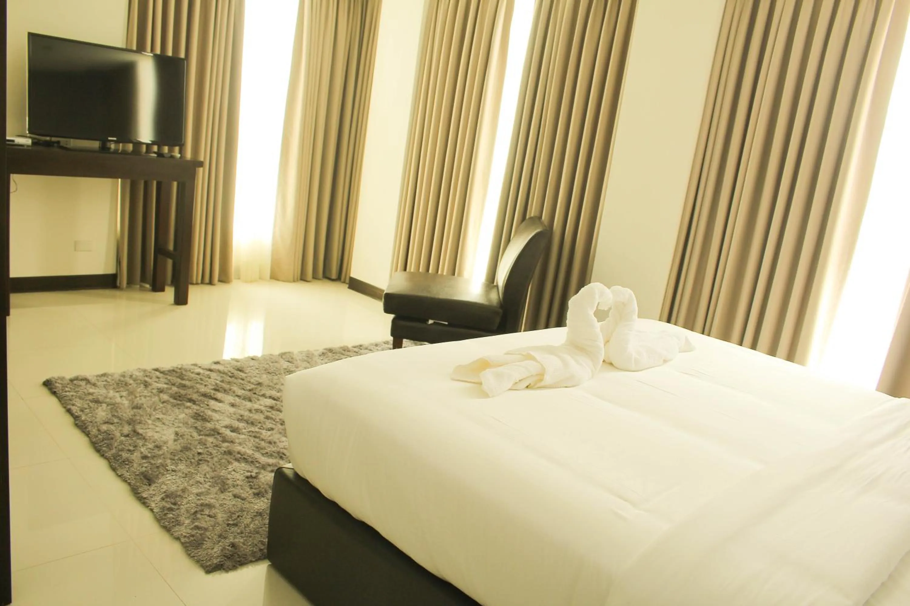 Bed in The Pacifico Boutique Hotel