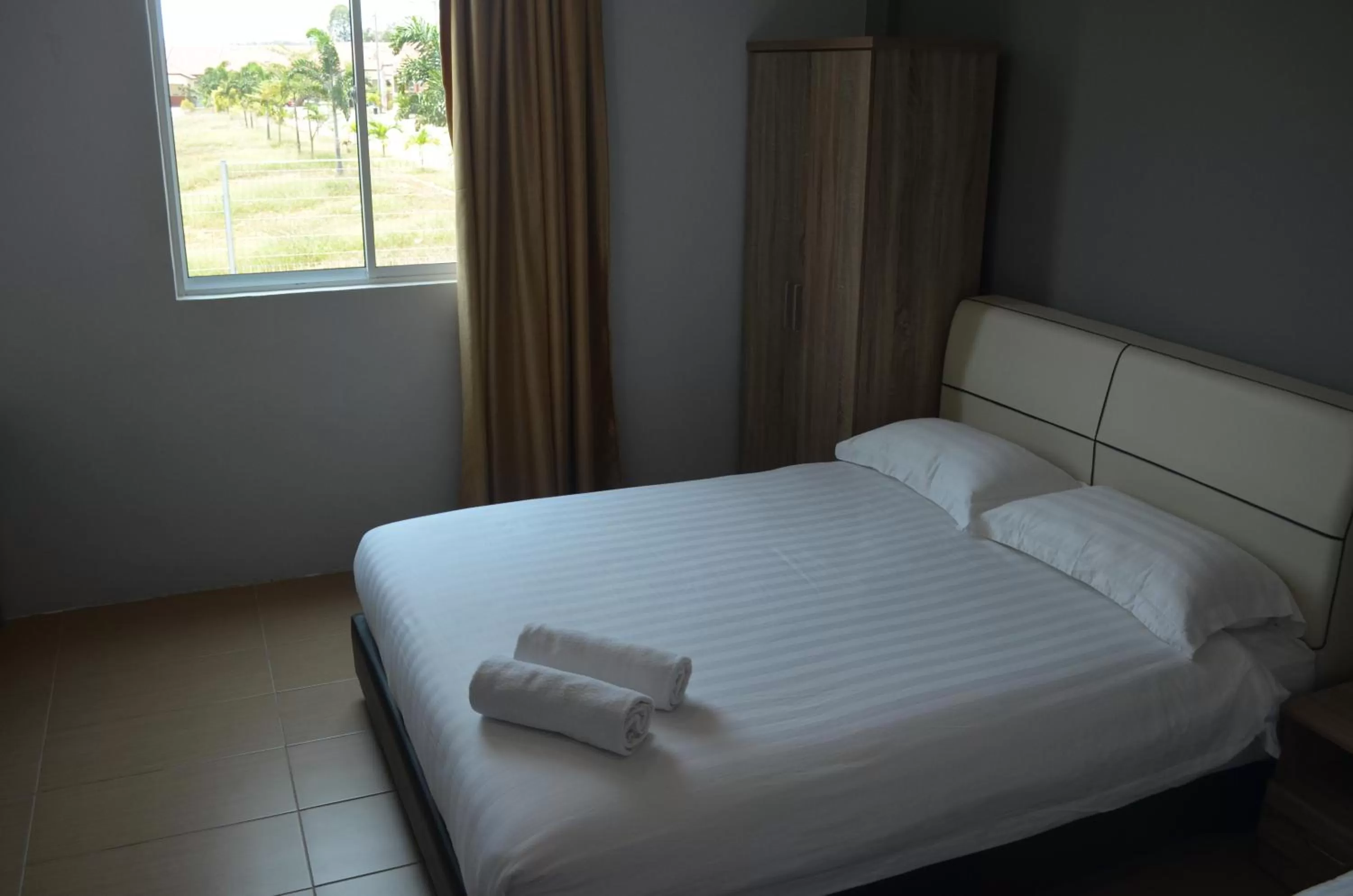 Bed in Welcome Inn GM