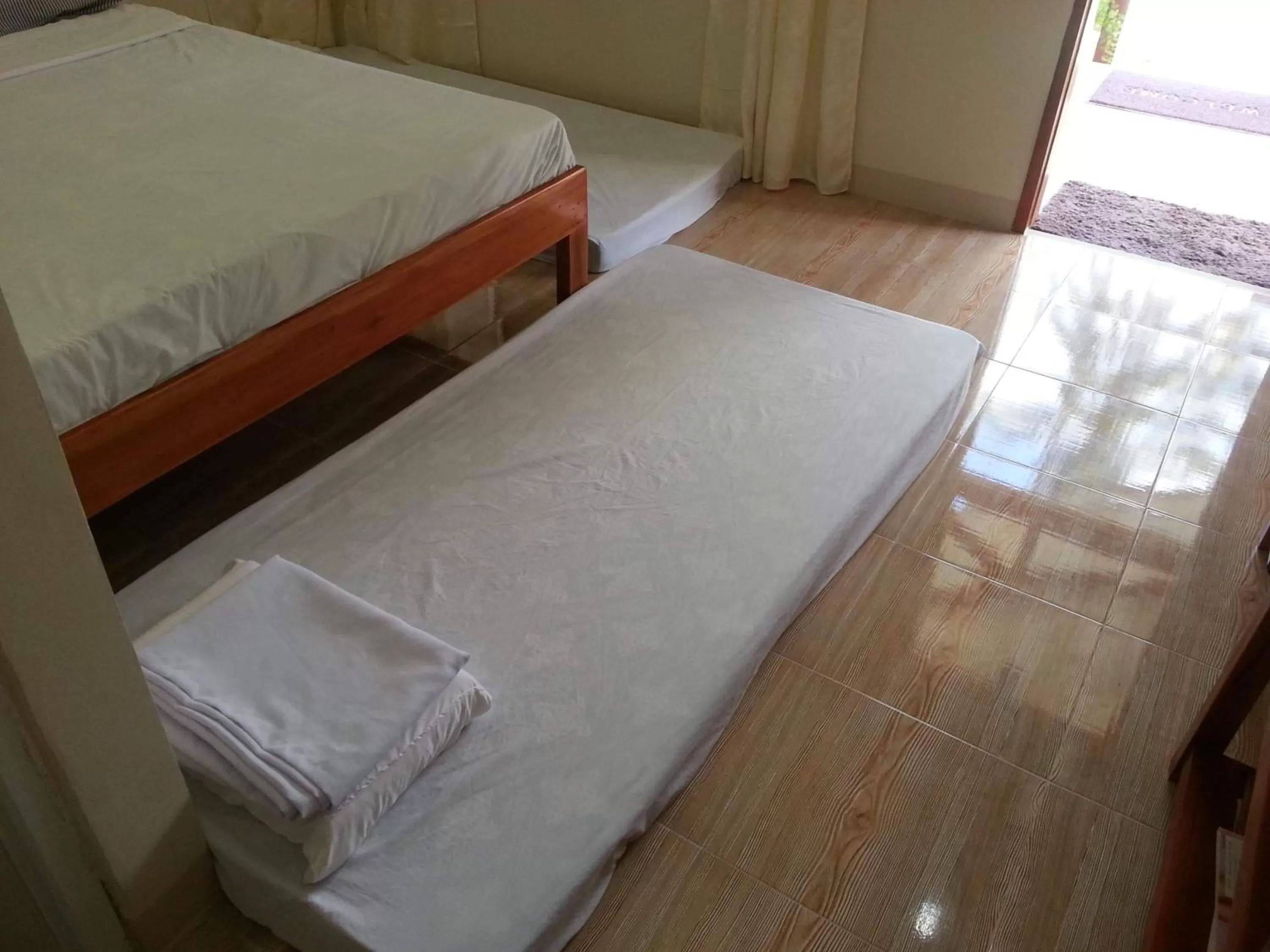 Bed in D's Oceanview Beach Resort