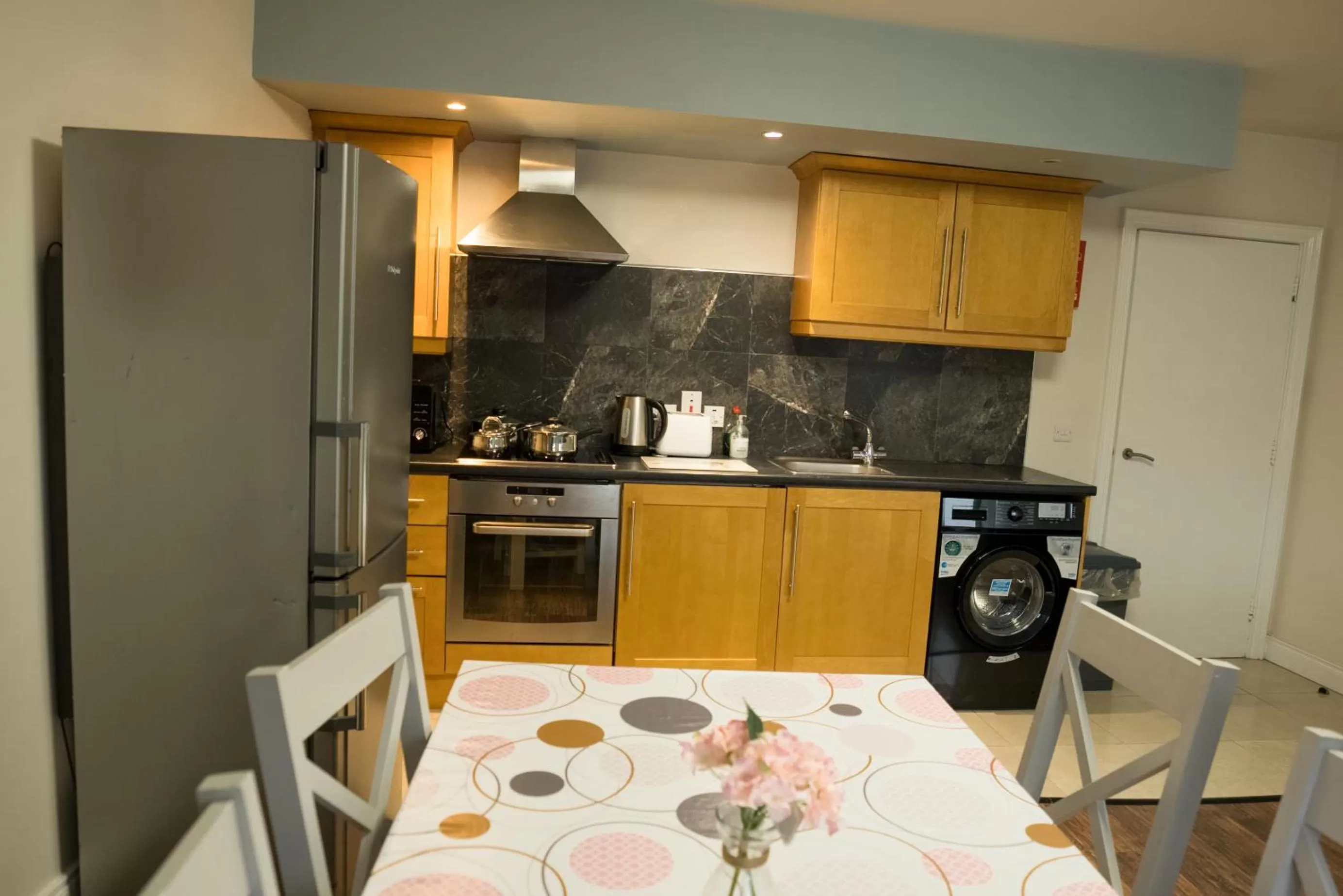 Kitchen or kitchenette in Walsh's Hotel and Apartments