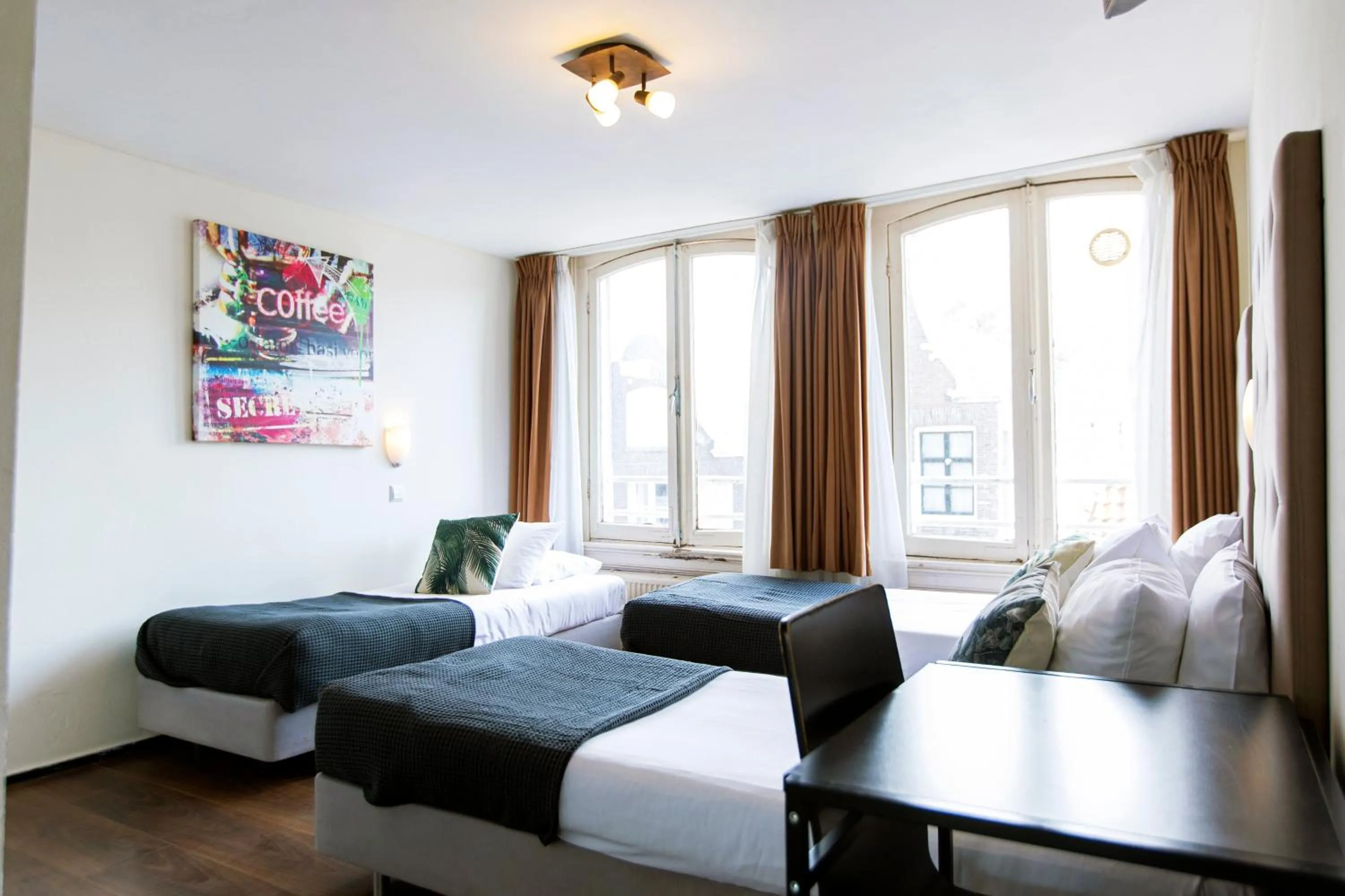 Bed in Quentin Arrive Hotel