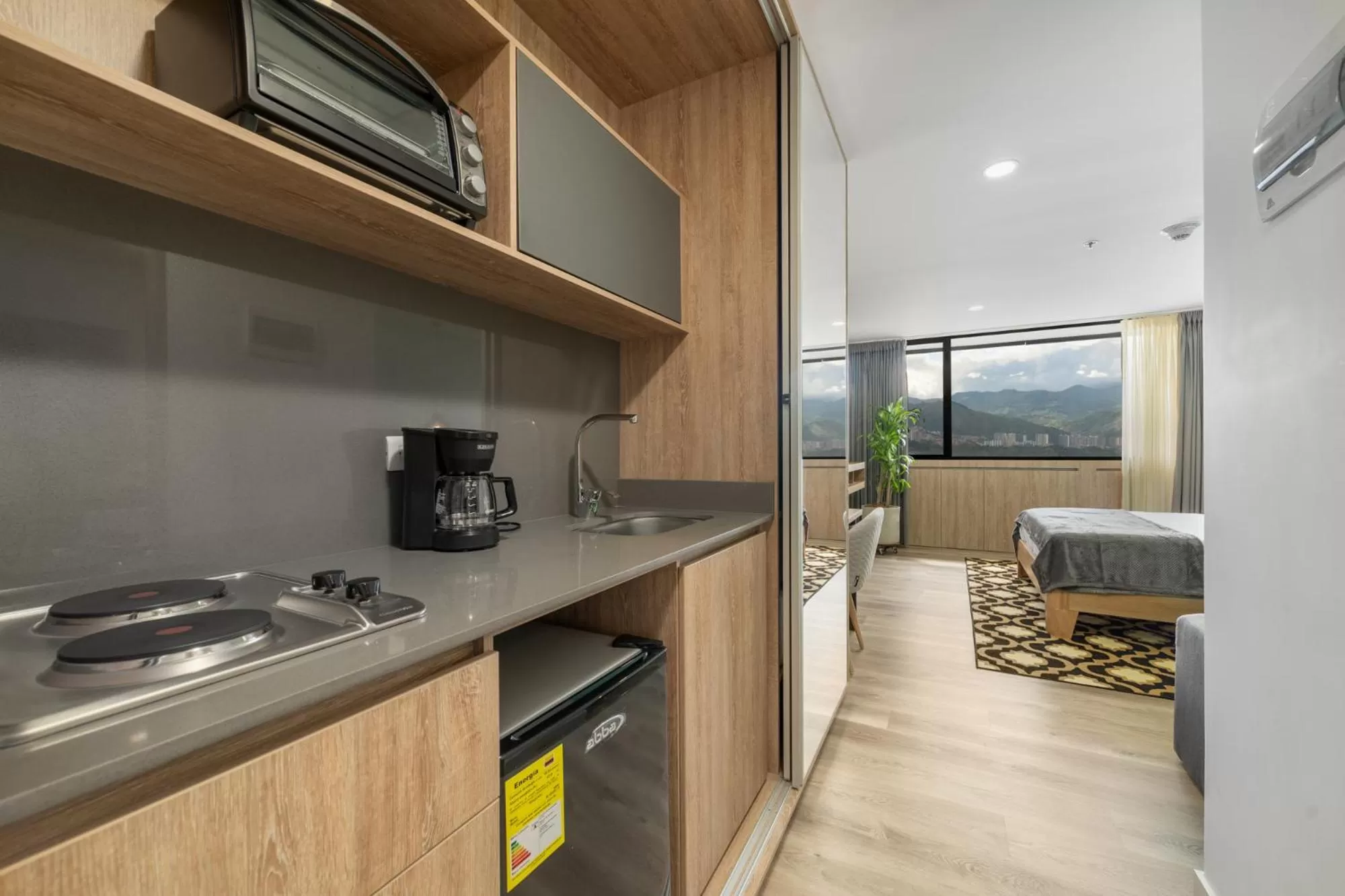 Kitchen or kitchenette in Apartamentos Go Living & Suites by HOUSY HOST