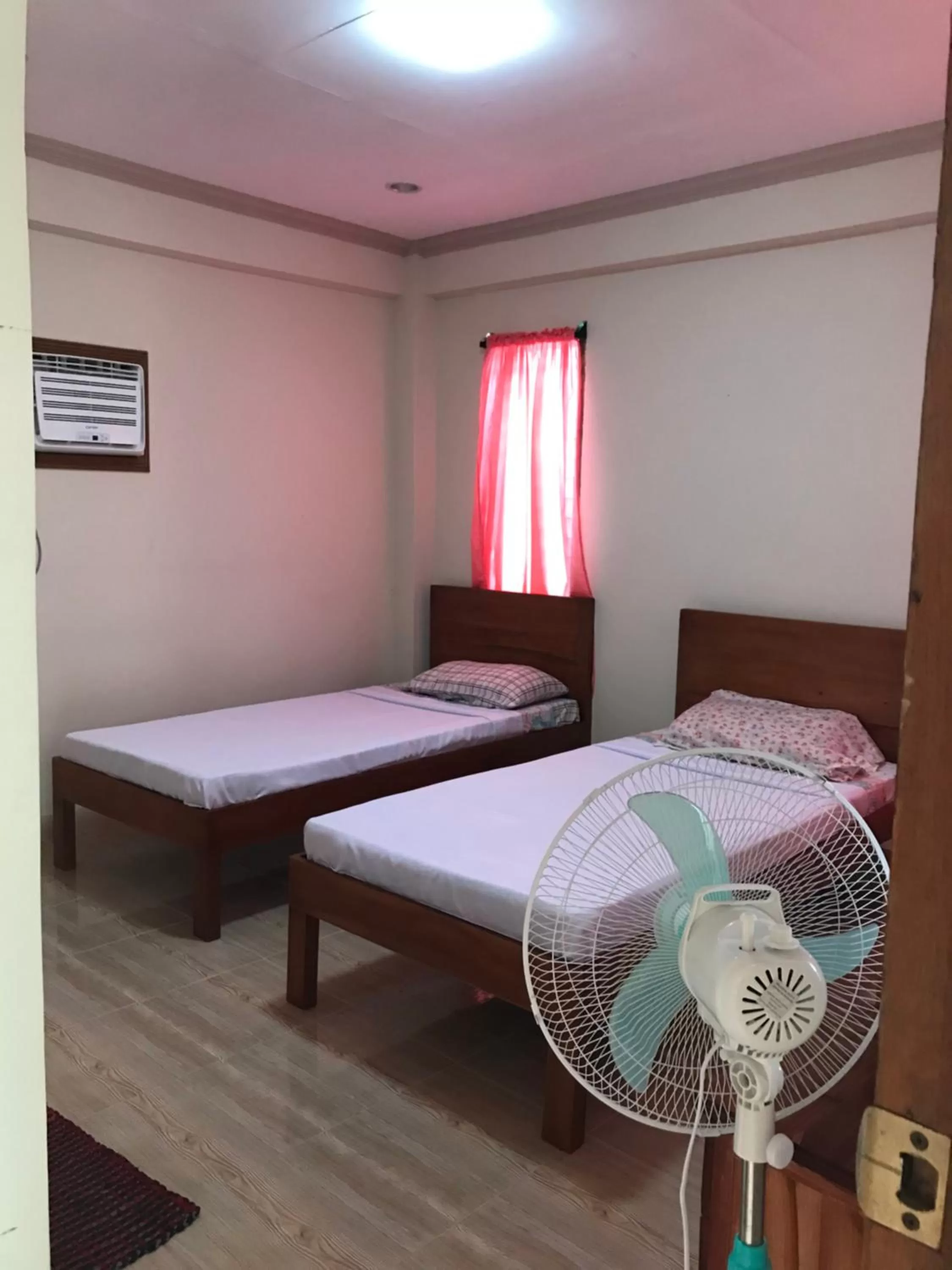 Bed in D's Oceanview Beach Resort