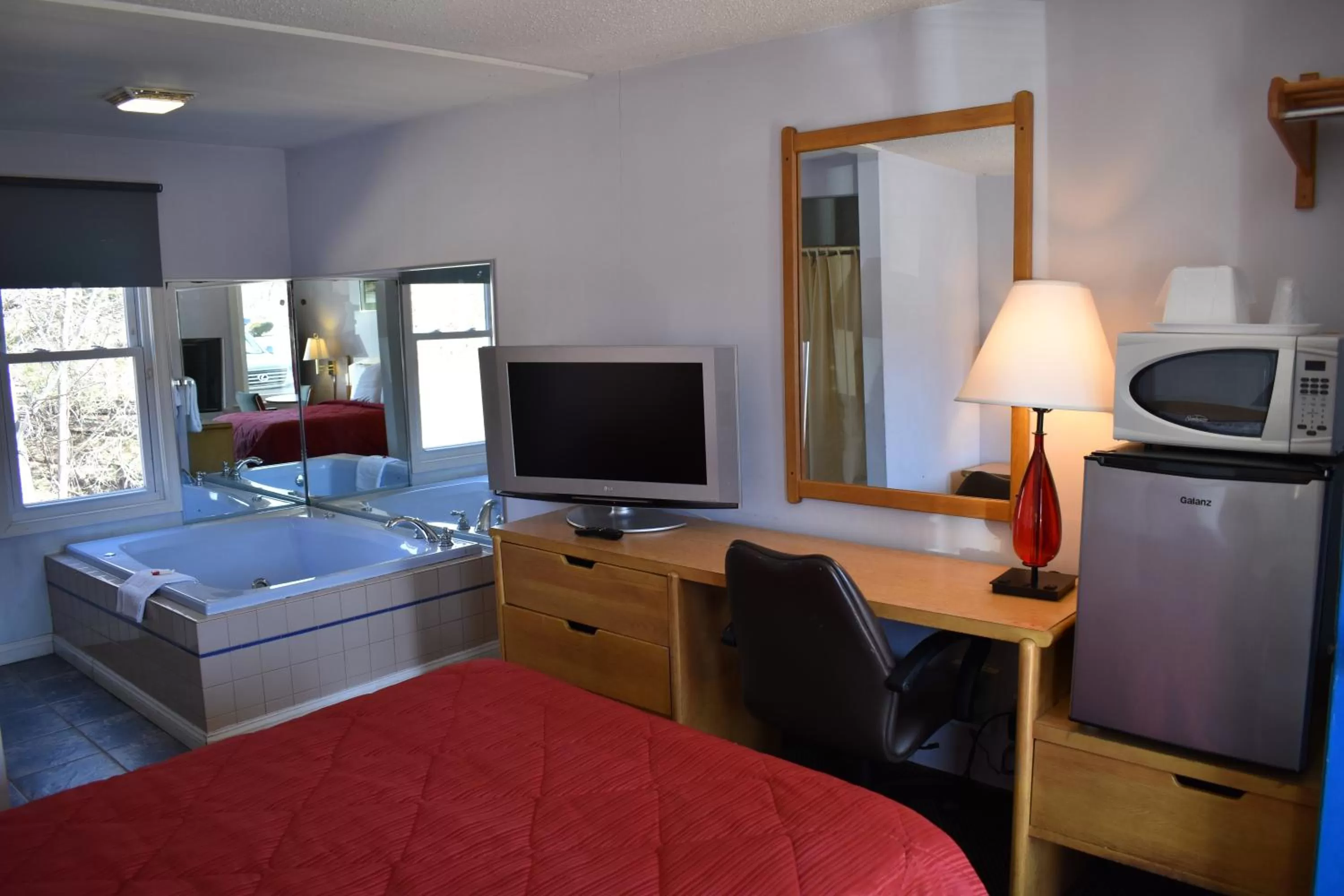 Bed in POCONO NIGHT LODGE