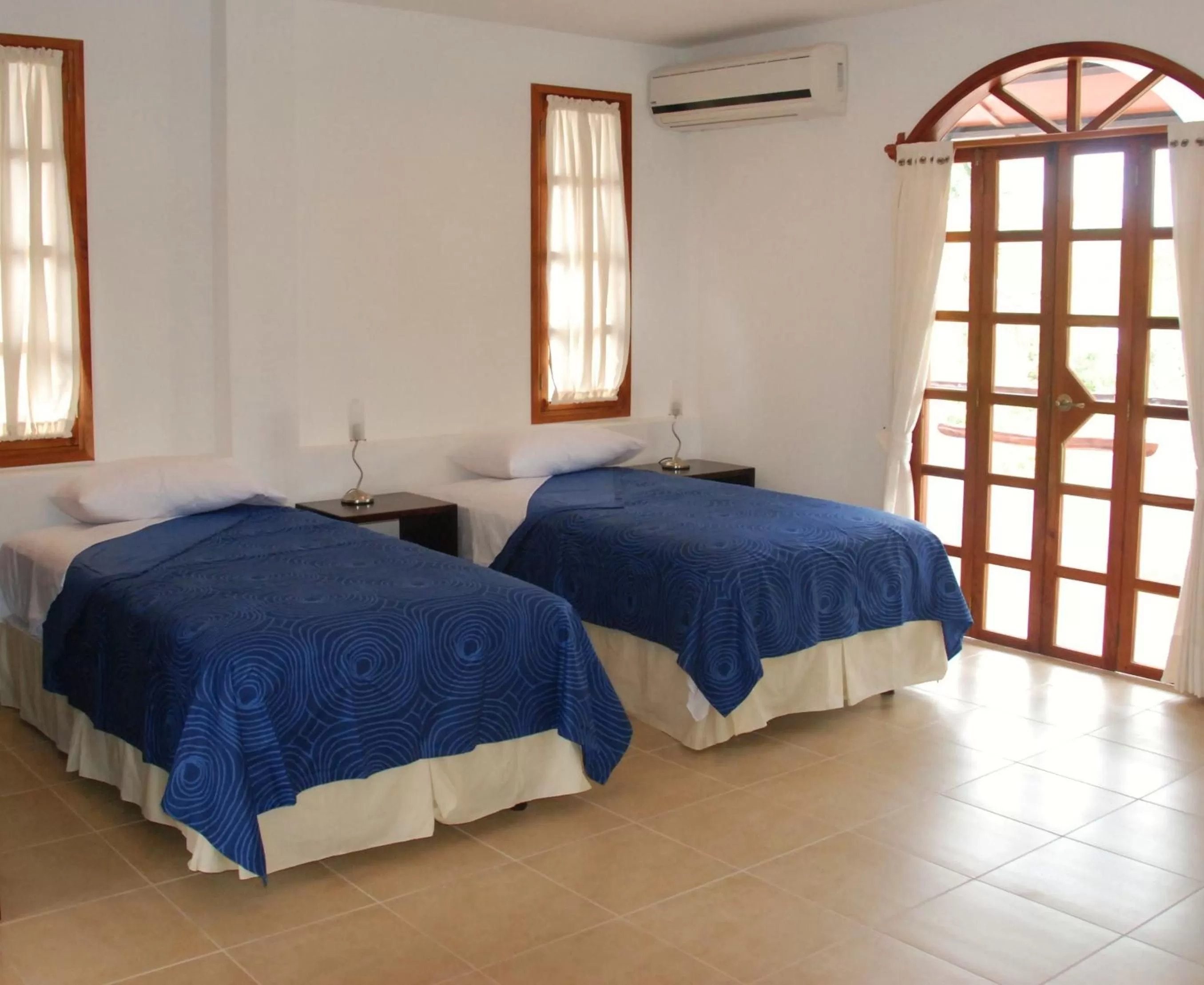 Bed in Hotel Galapagos Suites B&B