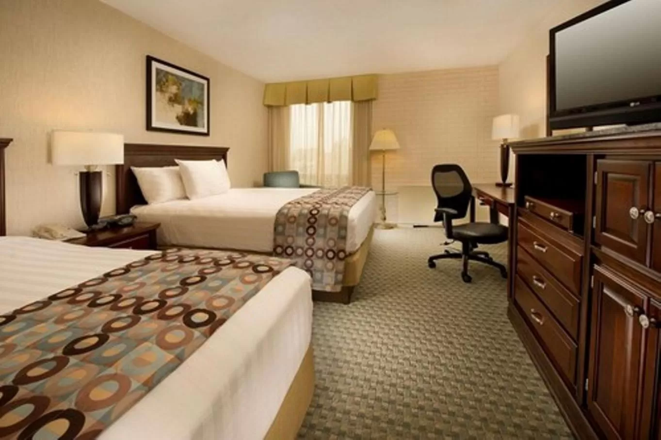 Bed in Hotel Lotus Kansas City Stadium