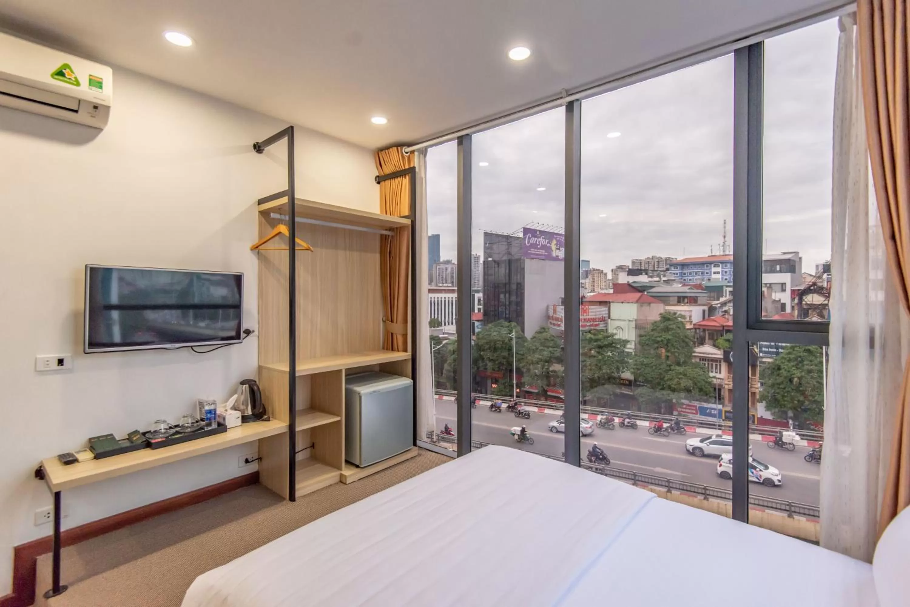 Communal lounge/ TV room, Bed in Coco Hotel Cau Giay