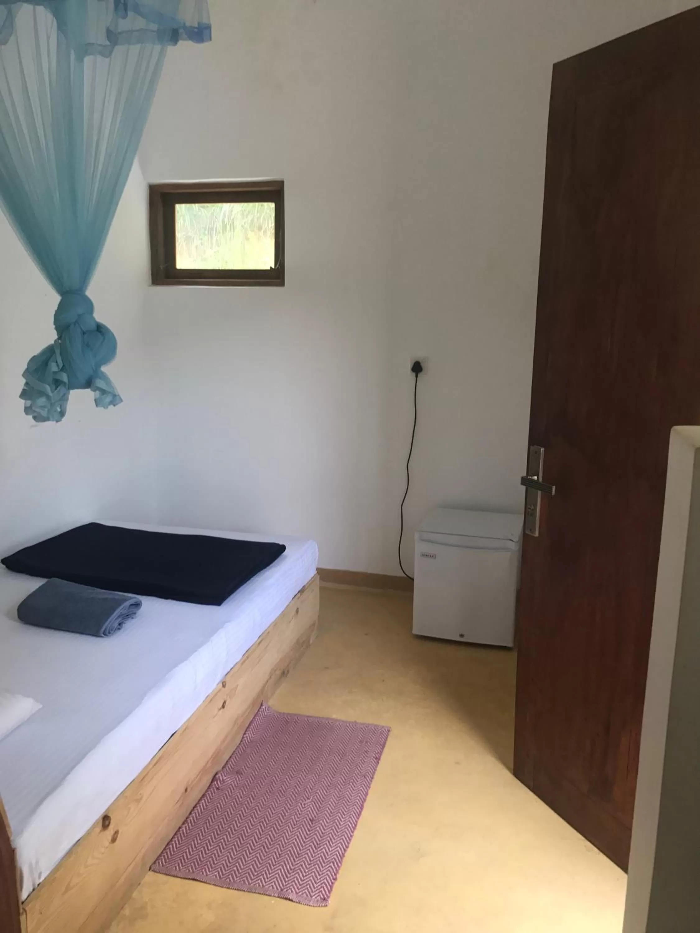 Bed in Raveena Guest House