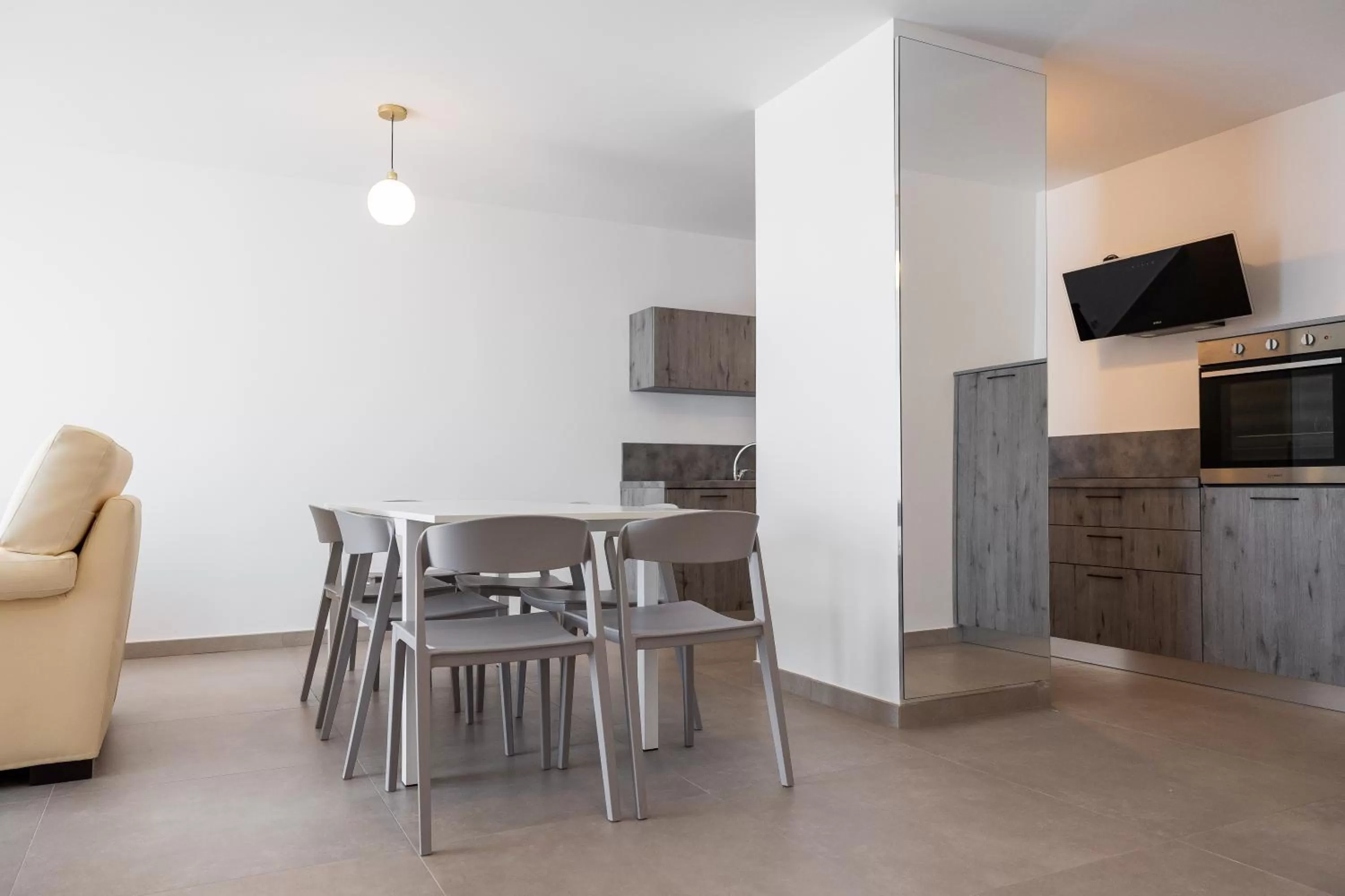 Communal lounge/ TV room in Hôtel Le Bastia