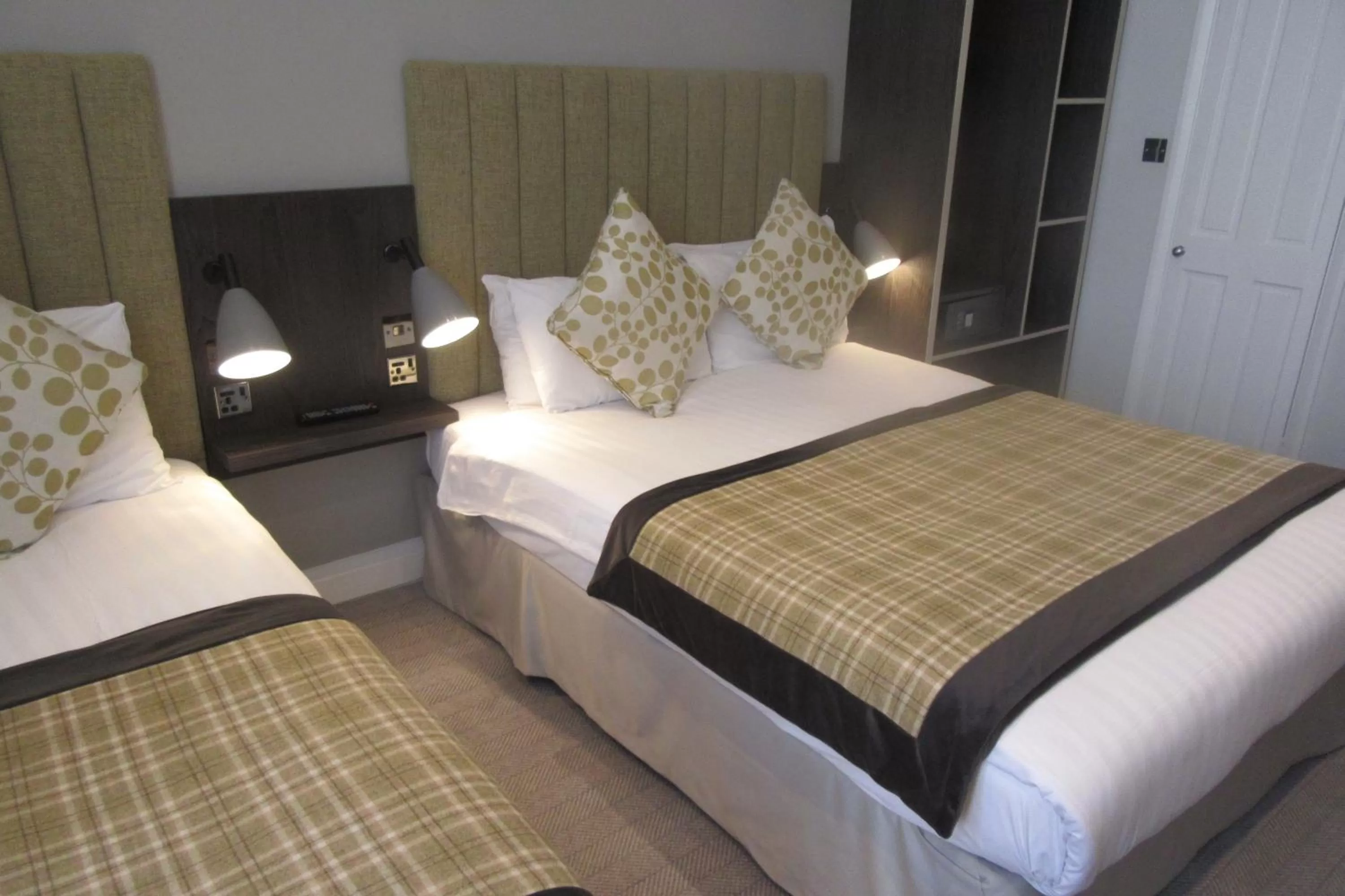 Bed in Garden Court Hotel