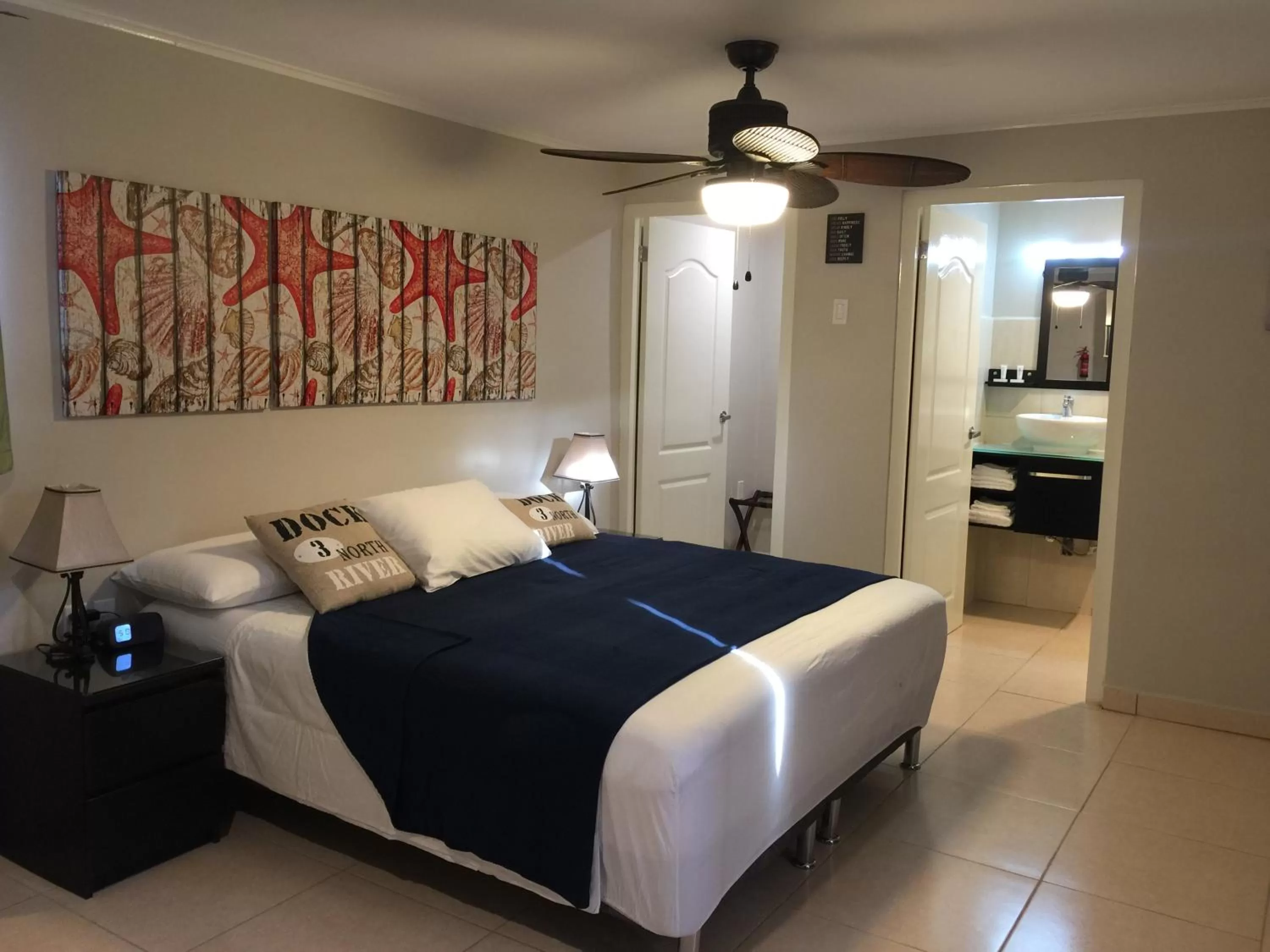 Bed in The Pier Beach Inn & Suites