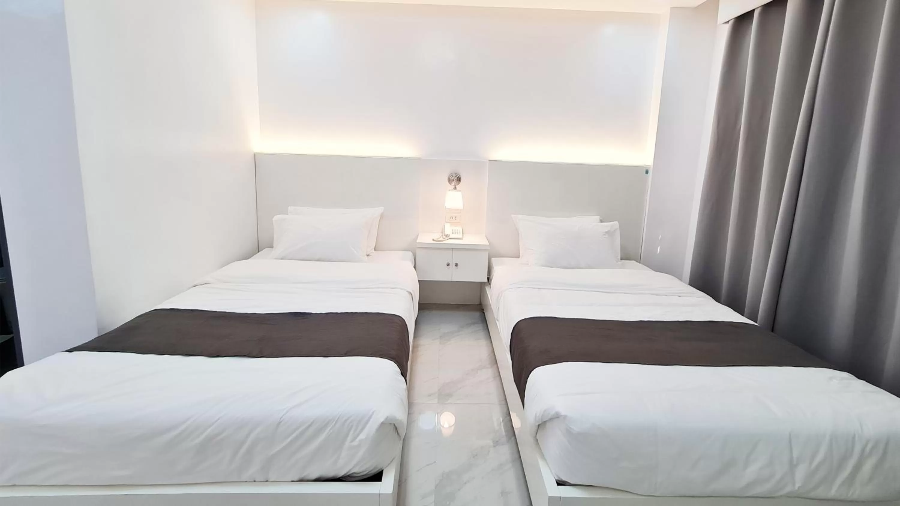 Bed in Staycation Hotel