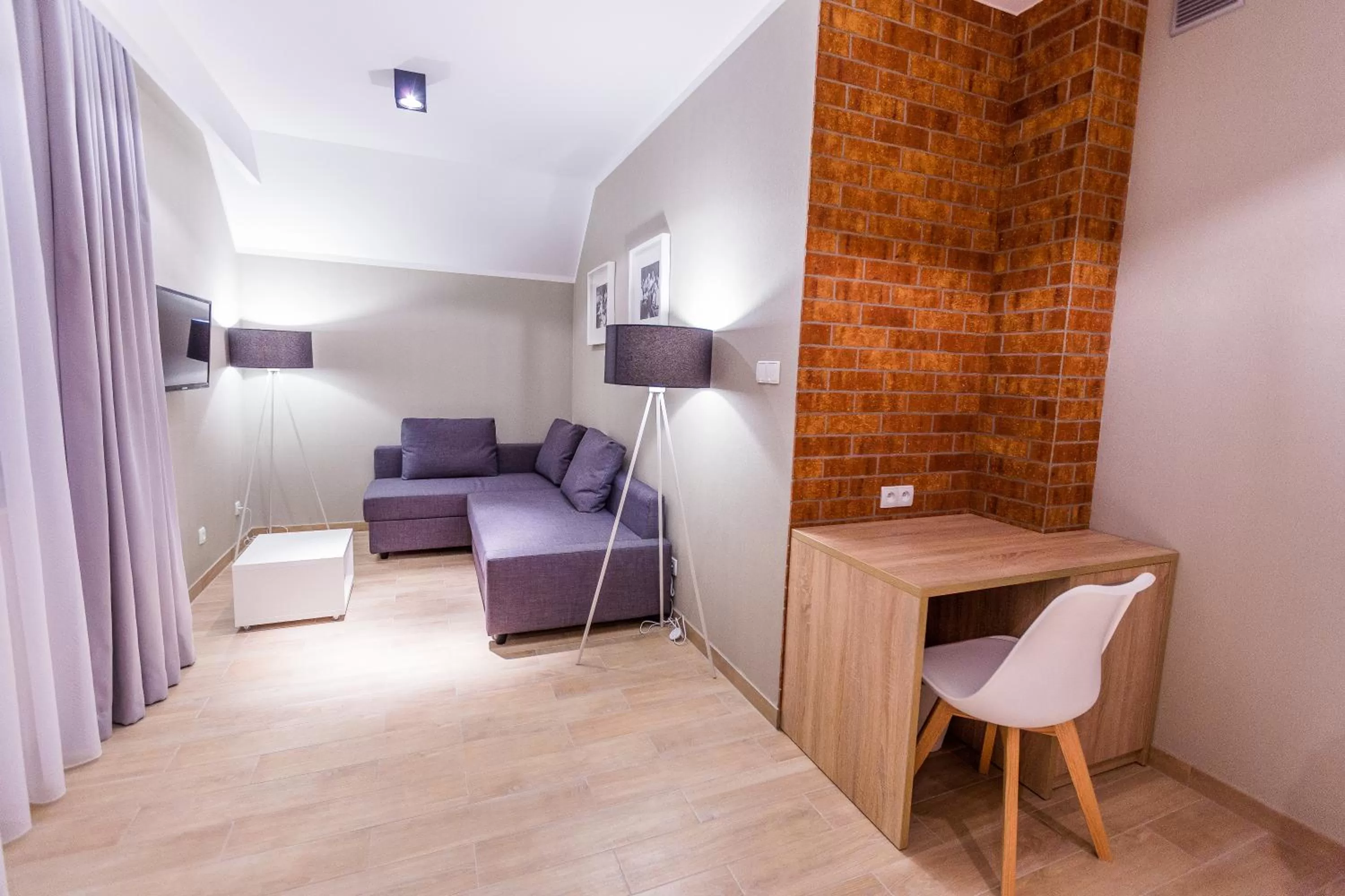 Seating area, Bed in Hotel Falcon