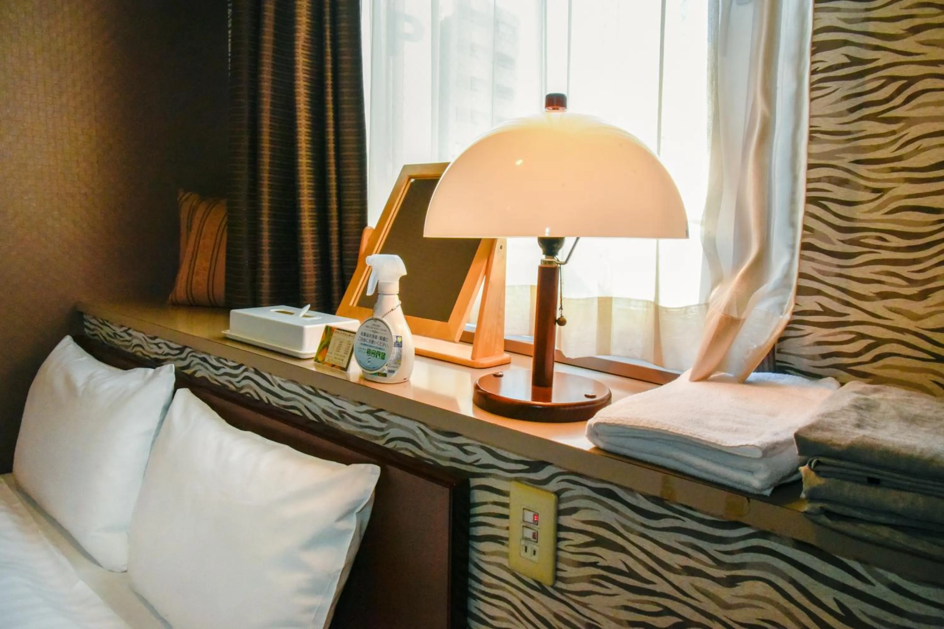 Bed in Hotel Palms Tenmonkan