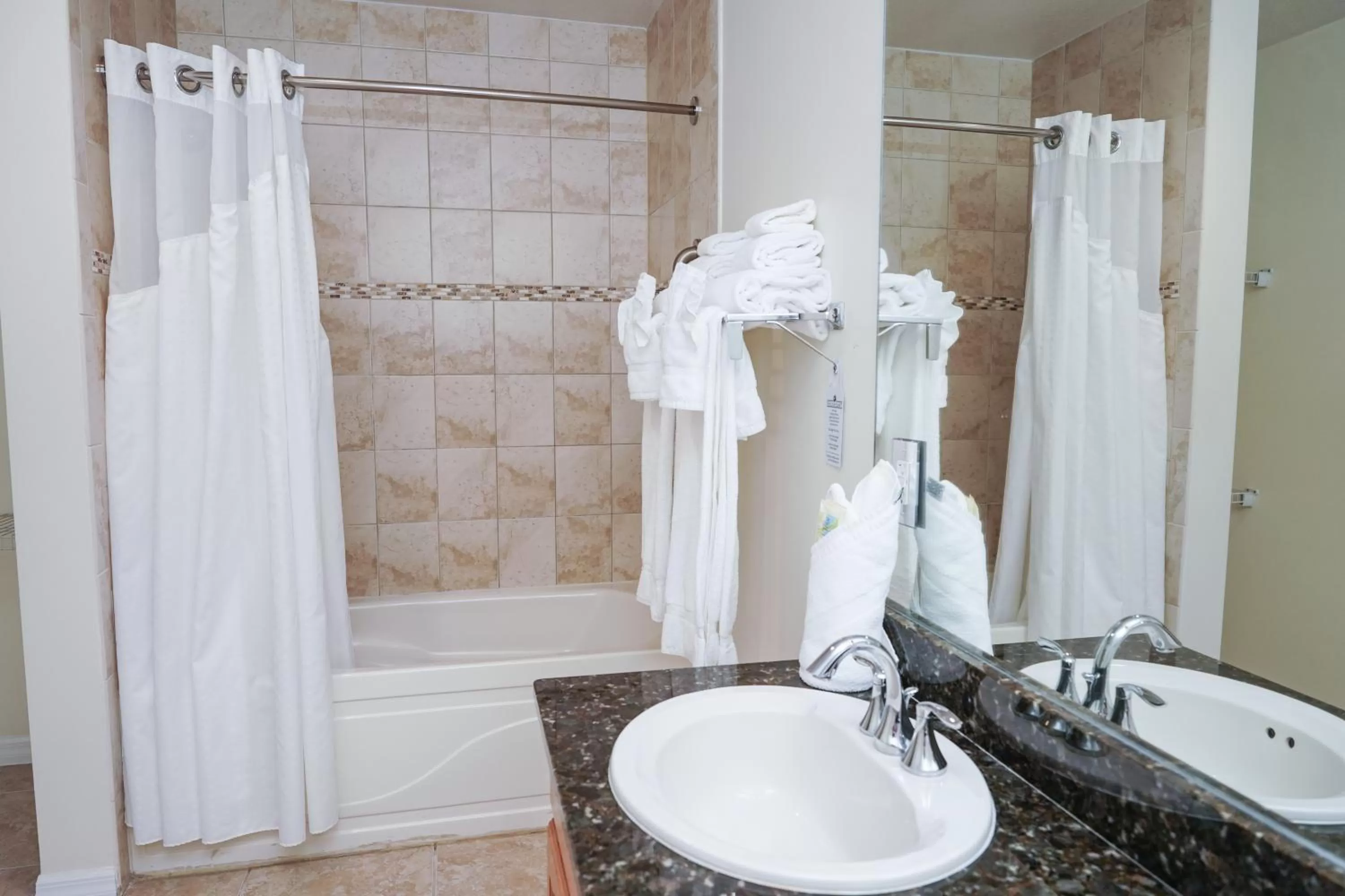 Shower in Holiday Inn Resort Grand Cayman by IHG