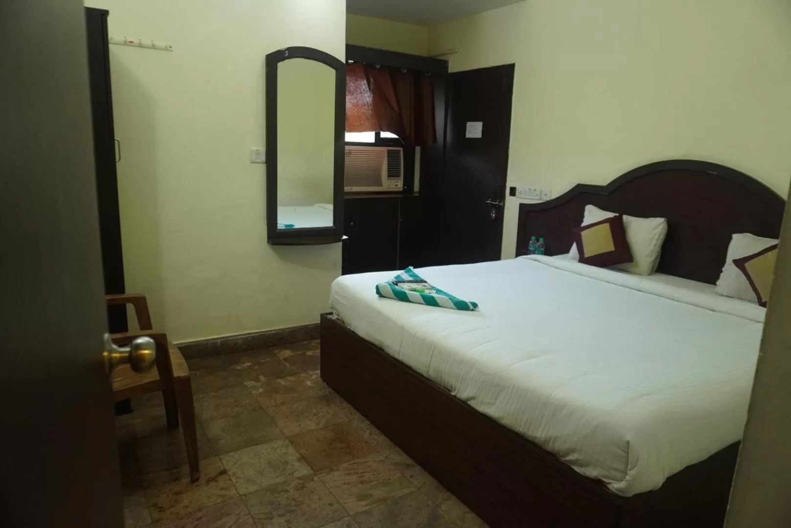 Photo of the whole room, Bed in The Dolphin Park Hotel, Virugambakkam