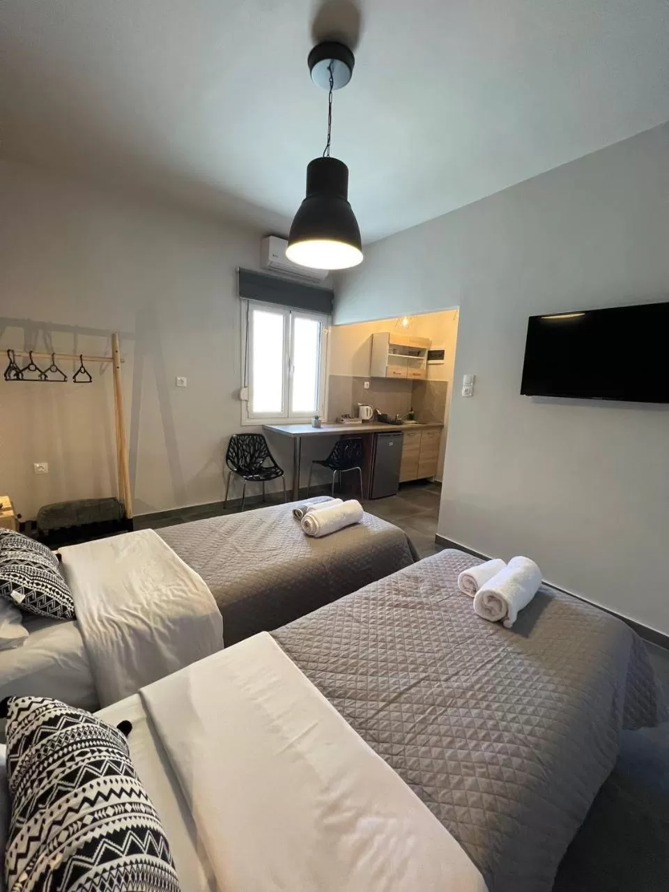 Bed in Elefsinian Mysteries Apartments