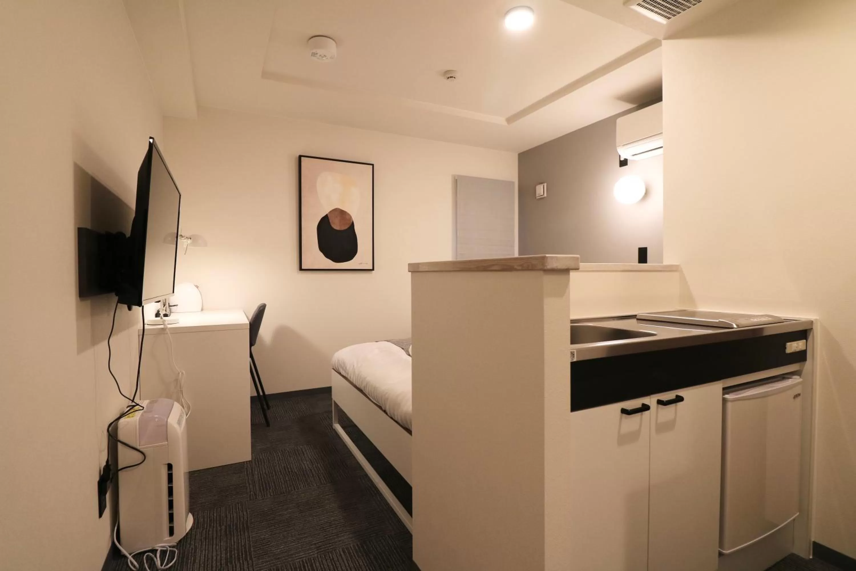 Kitchen or kitchenette in TAKETO STAY PREMIERE SAPPORO Eki