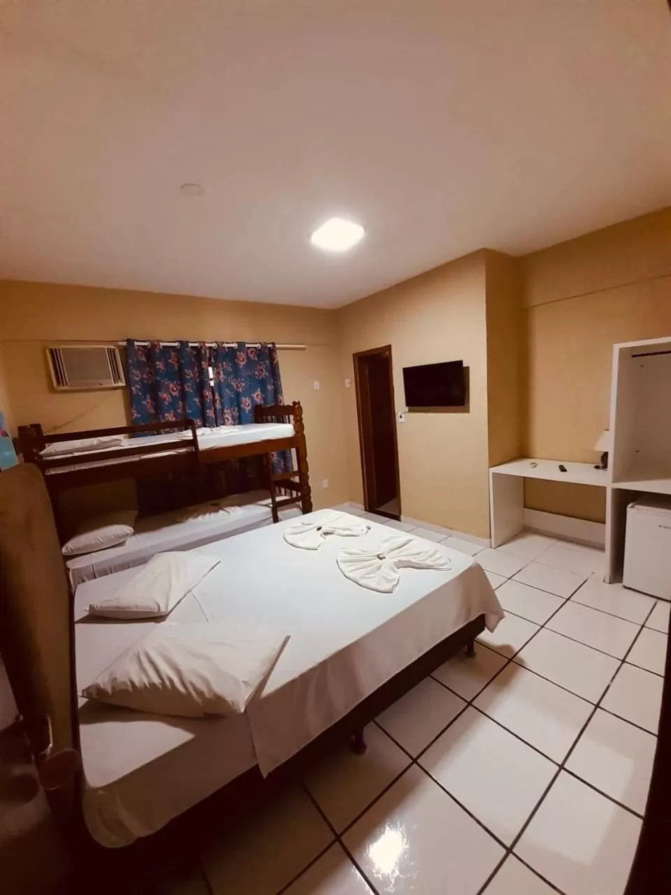 Bed in Flamingo Beach Pousada