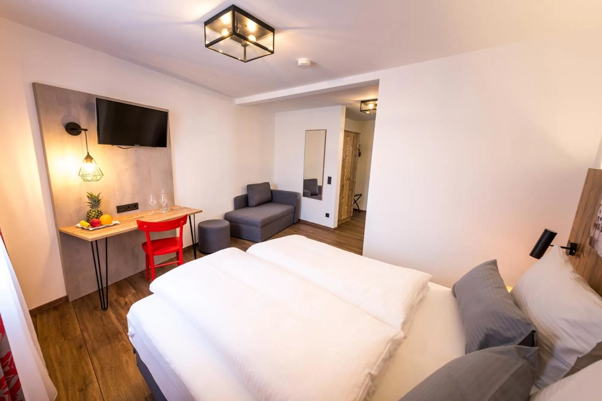 Photo of the whole room, Bed in Hotel & Brauerei-Gasthof Neuwirt