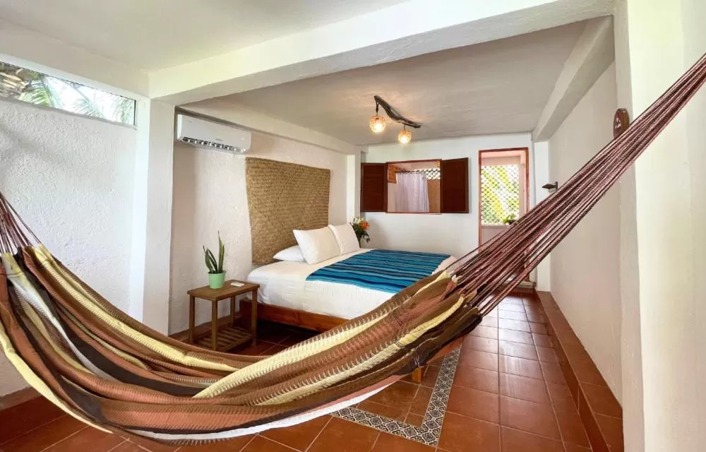 Bed in Hotel Villas Colibrí Suites & Bungalows