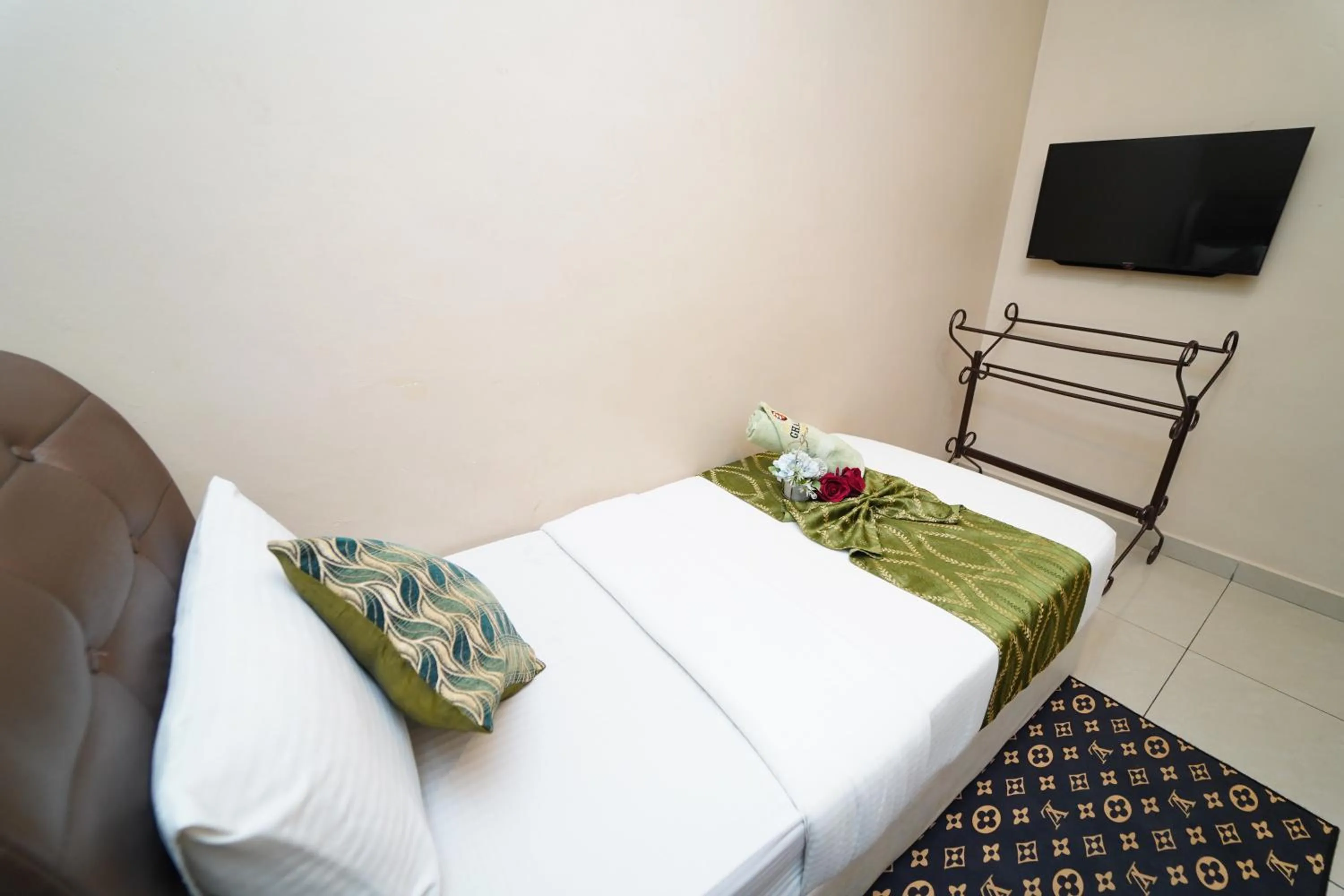 Bed in Ghazrin's Classic Hotel JB