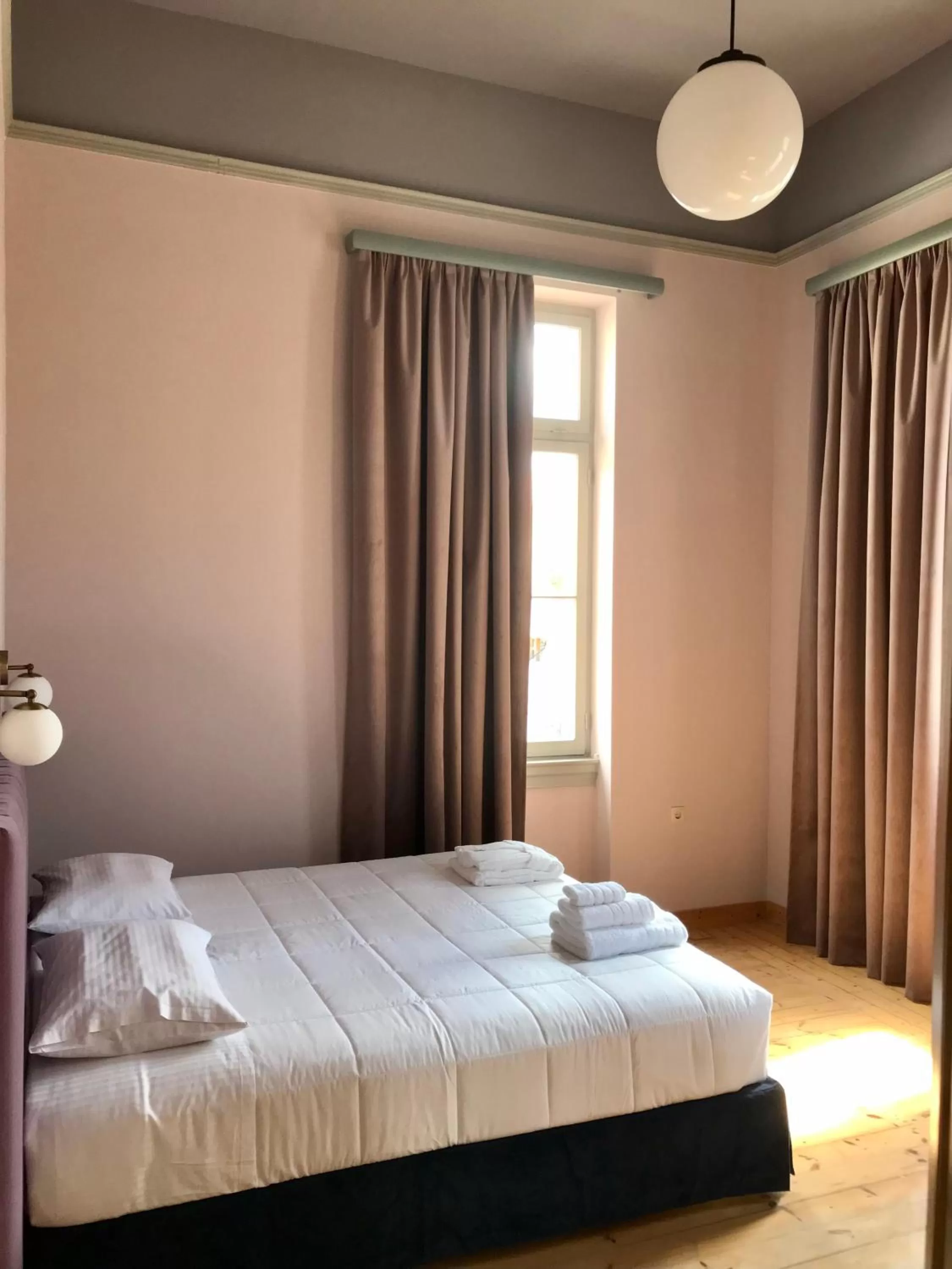 Photo of the whole room, Bed in VASILIKON Hotel 1888 the past is present HISTORICAL PRESERVATION MONUMENT