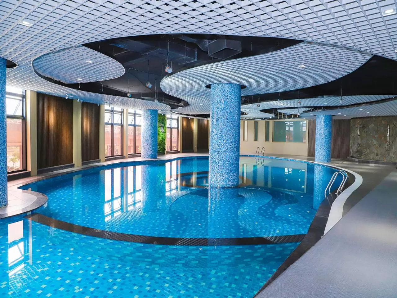 Swimming pool in Ramada Hotel & Suites by Wyndham Halong Bay View