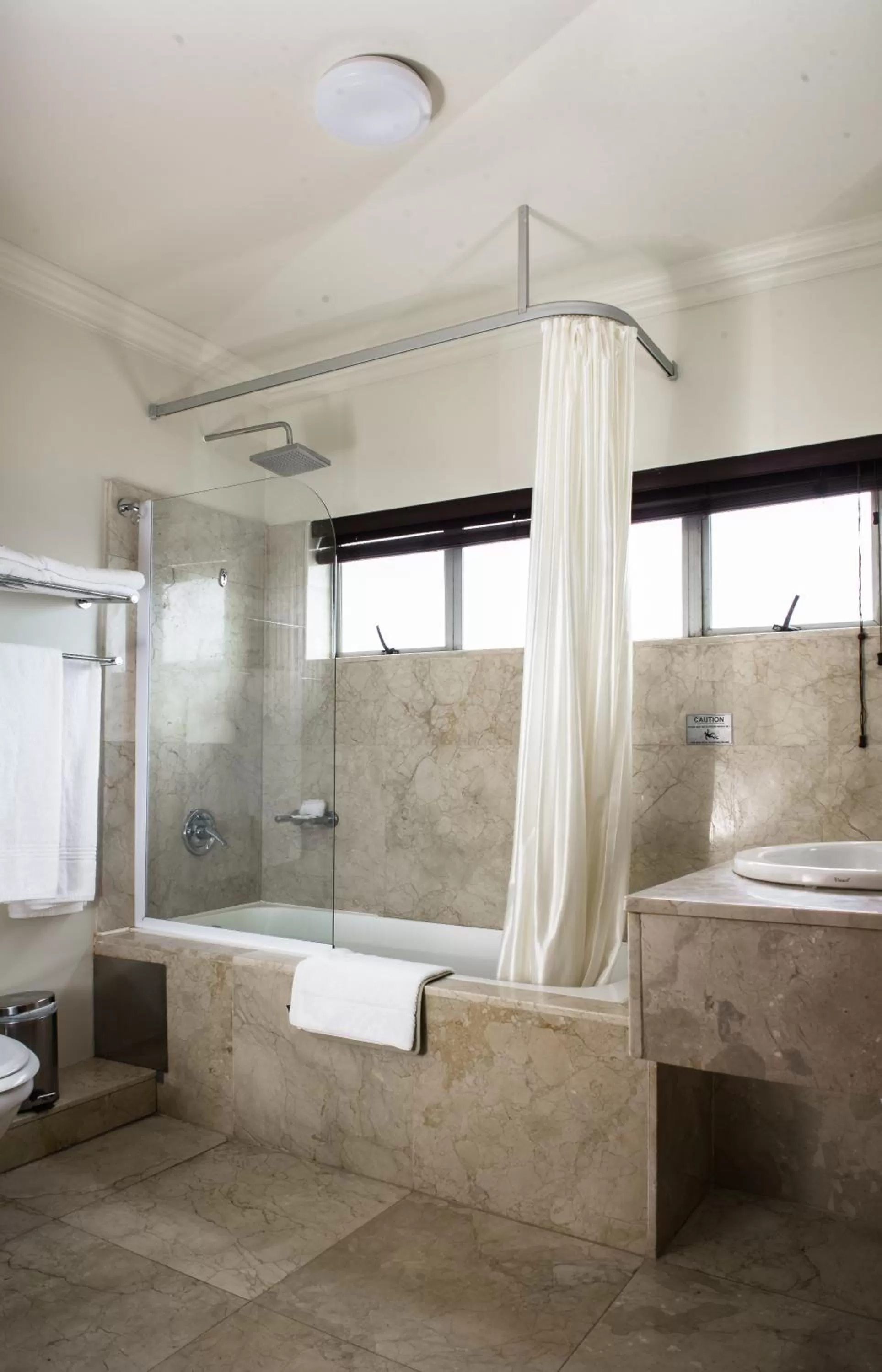Bathroom in Belaire Suites Hotel