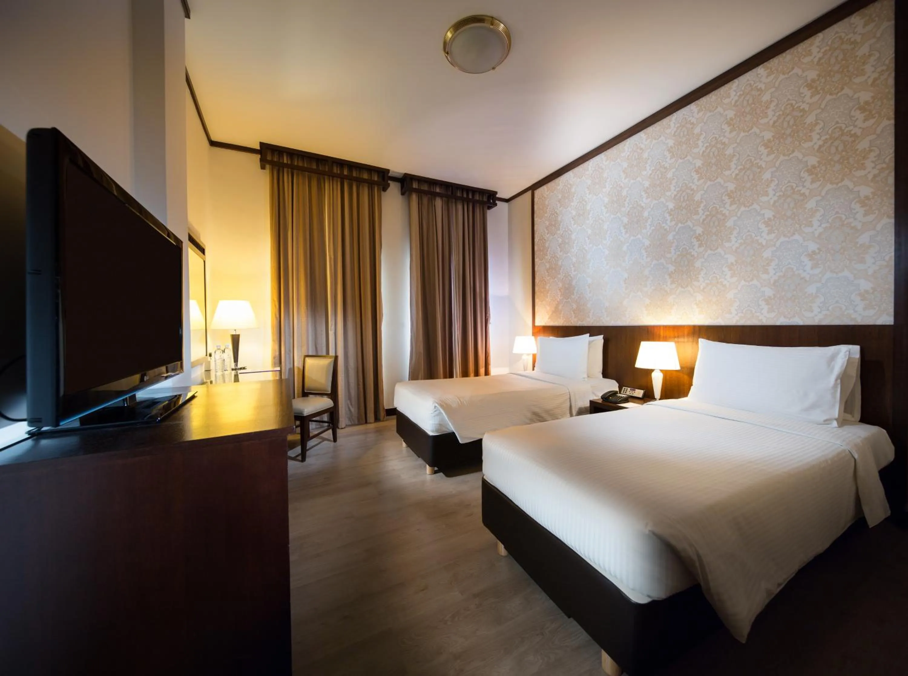 Communal lounge/ TV room, Bed in Village Hotel Albert Court by Far East Hospitality