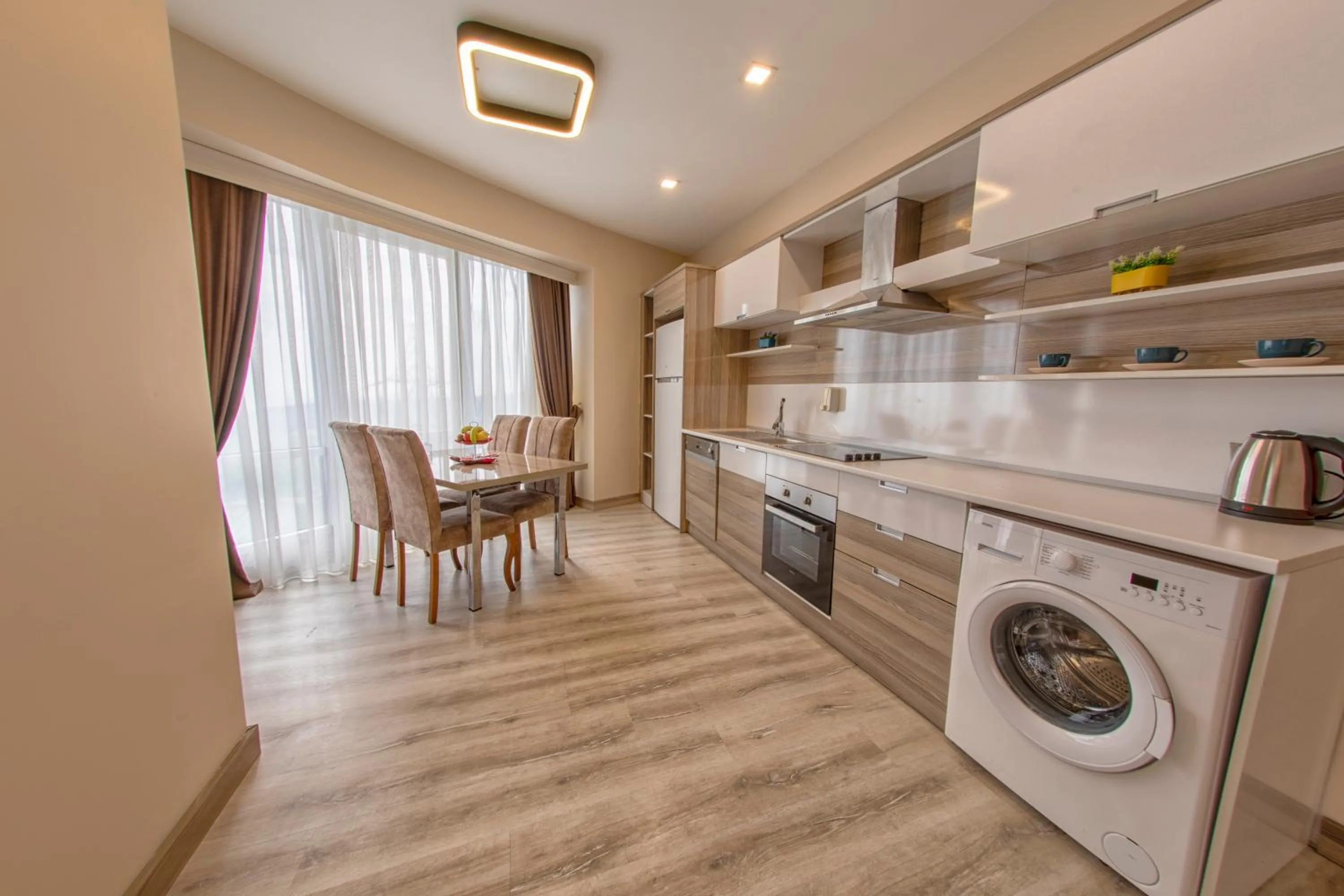 Kitchen or kitchenette in My House N5 Suites Hotel